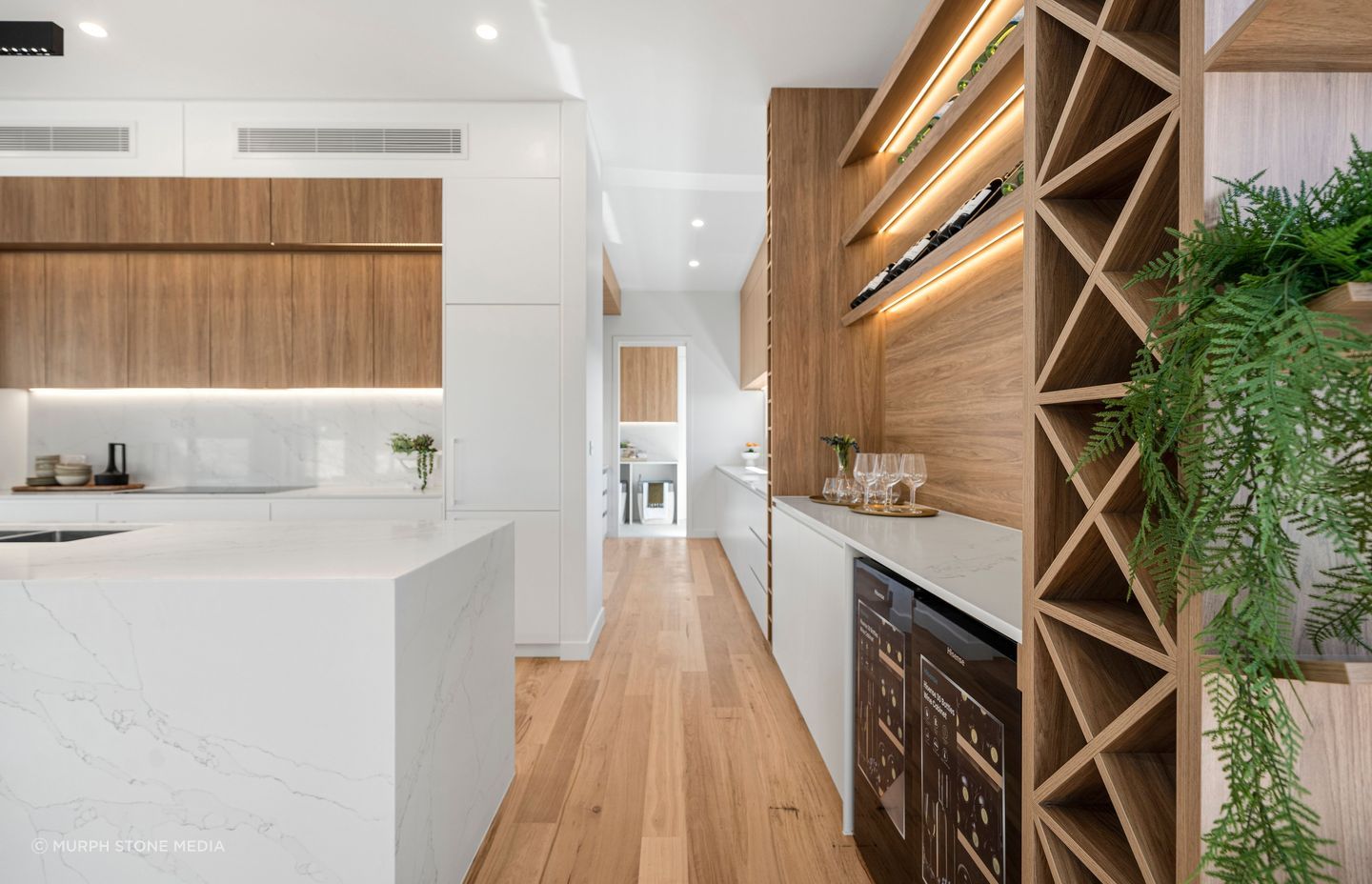 Bringing biophilic elements and materials, such as plants and timber accents, into a space is an easy way to create a sense of serenity.