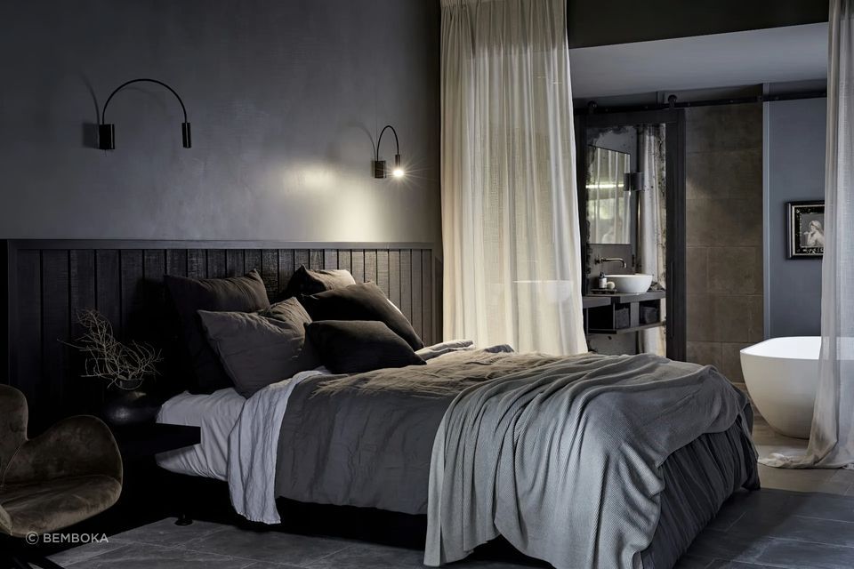 Bemboka linen duvet and reversible rib cotton throw styled in a moody, layered bedroom at The Bower Byron Bay.