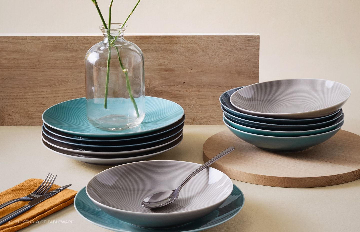 Your dinnerware should complement your dining room decor in colour, shape and style, seen here with Loft Colours Dinnerware by The Studio of Tableware.