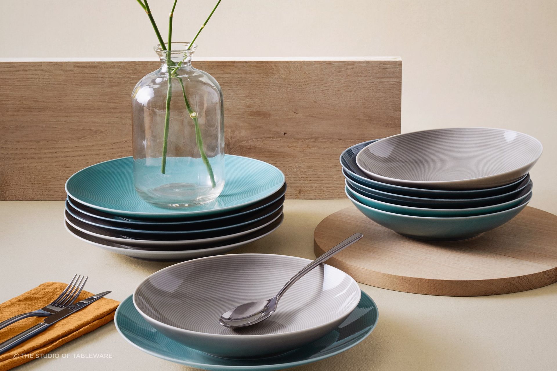Your dinnerware should complement your dining room decor in colour, shape and style, seen here with Loft Colours Dinnerware by The Studio of Tableware.