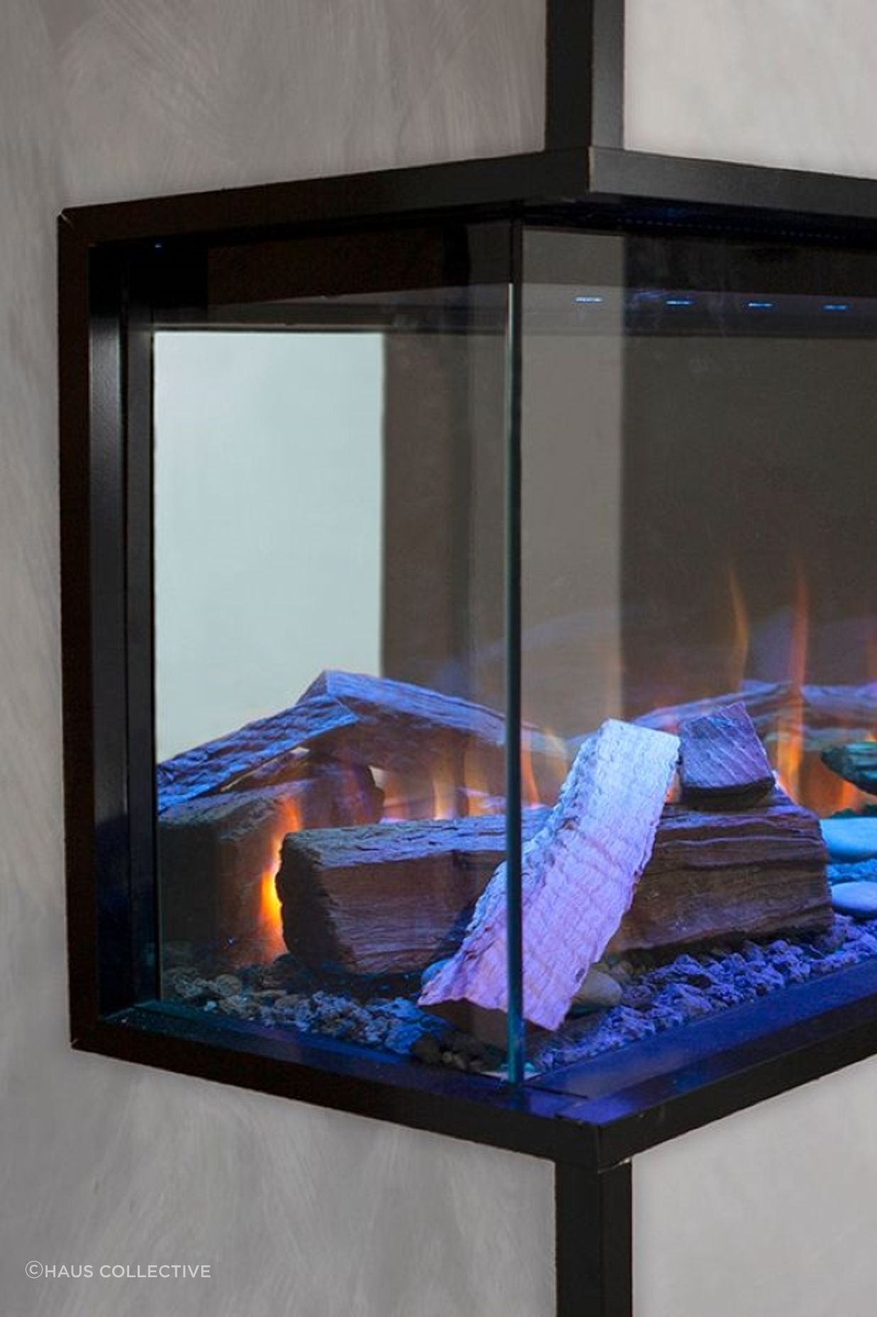 The blue flames that the Visionline Electric Fireplace offer elevate the sense of visual intrigue.