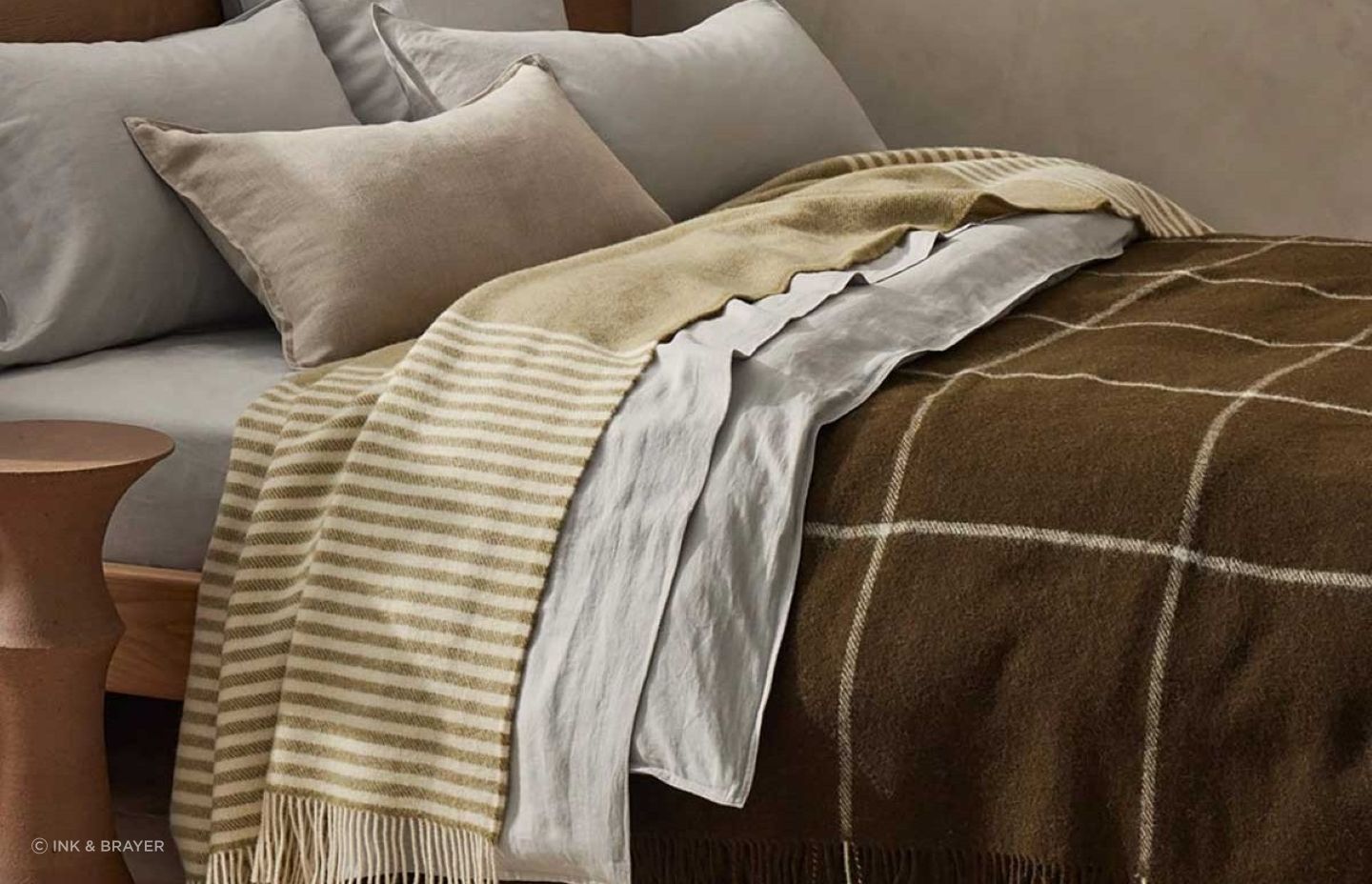 The Weave Home Catlins Wool Throw Blanket by Ink & Brayer adds a beautiful accent of texture and colour.