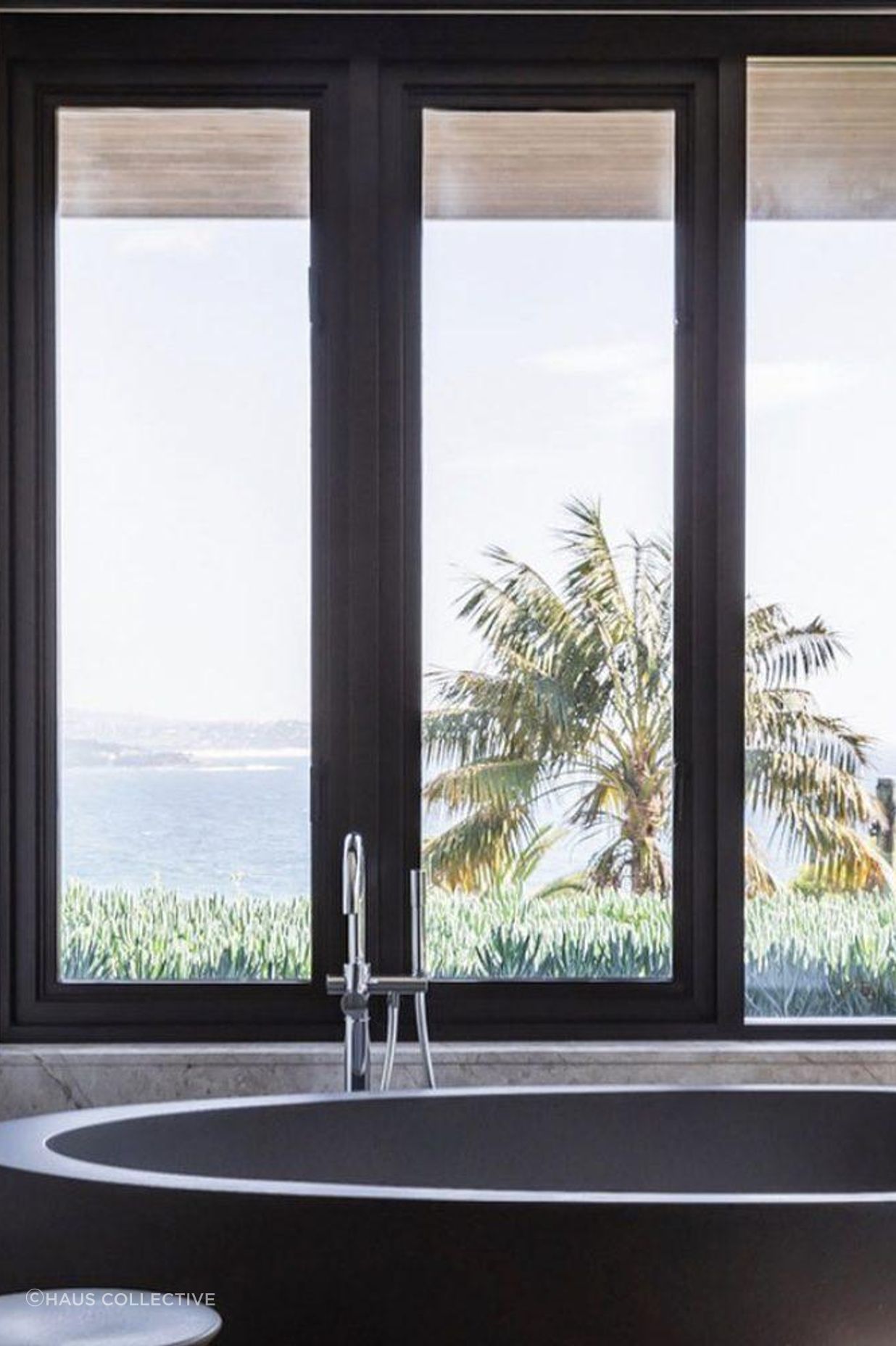 A freestanding bath is the perfect place to enjoy a view of the coast.