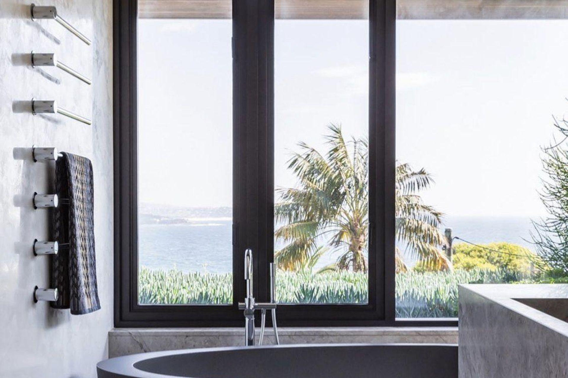 A freestanding bath is the perfect place to enjoy a view of the coast.
