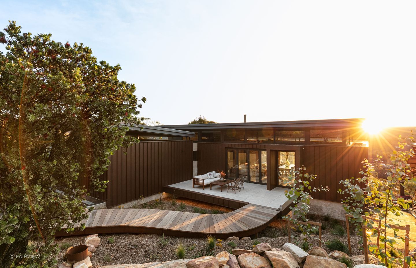 The cladding features distinctive tall, sharp ribs and flat smooth pan profiles, creating a bold and modern look in both rural and urban settings. Featured product: Vitraloc - Roll Formed Steel Cladding.