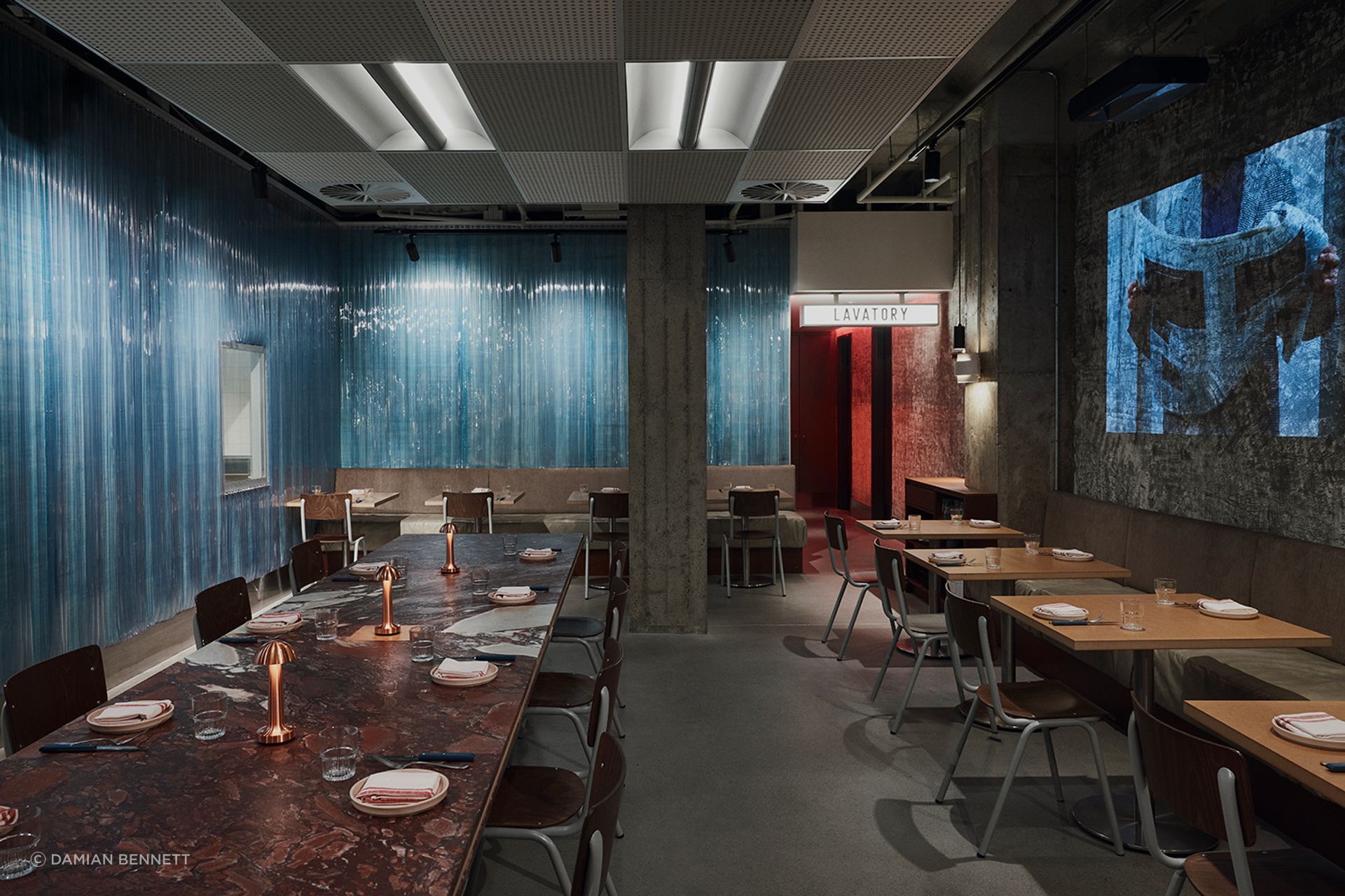 Influenced by London’s East End, the interiors of Alfie's by Tom Mark Henry celebrate the brutalist and utilitarian.