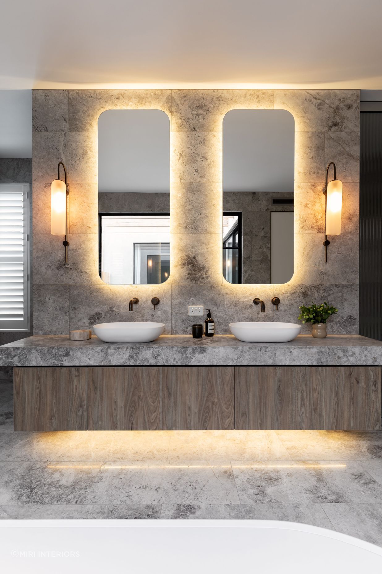 Stylish bathroom lights can help other key features stand out. Featured Project: Brighton Suite by Miri Interiors