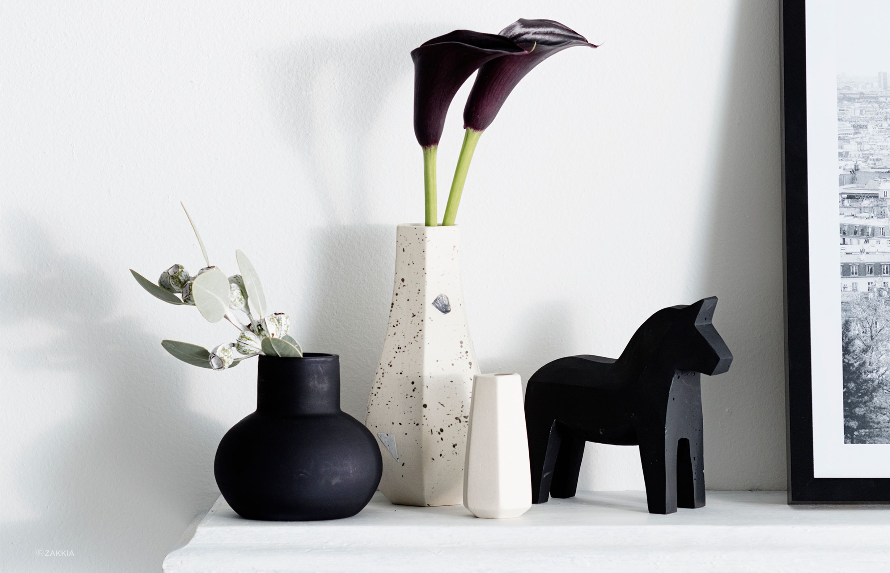 Functional yet decorative accessories such as this beautiful vase by Zakkia are great additions to a living room.