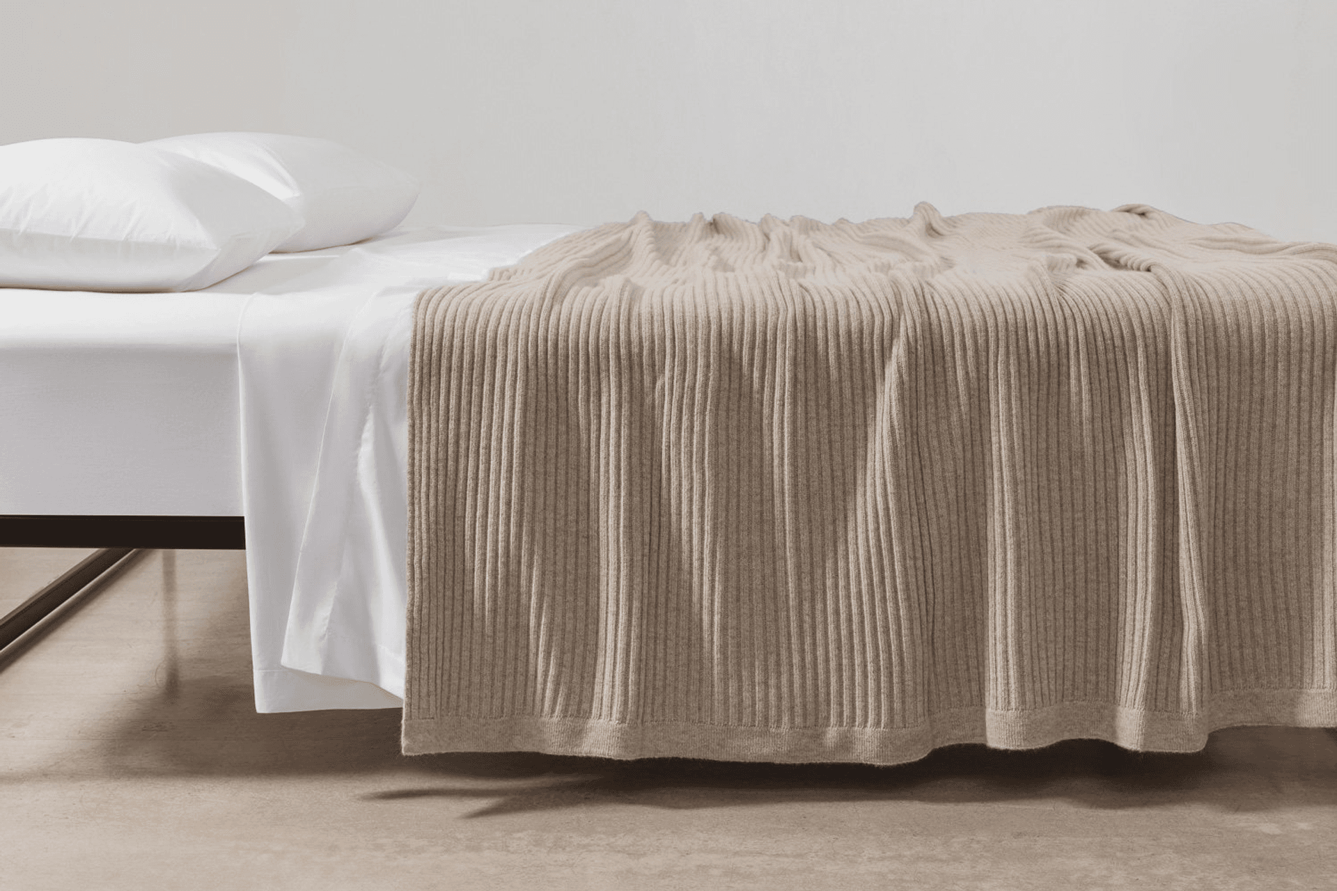 Bemboka Wide Rib Angora and Merino Wool Blanket in wheat shade paired with crisp percale cotton sheeting creates a soft, inviting, and stylish layering perfect for a cosy winter bedroom.