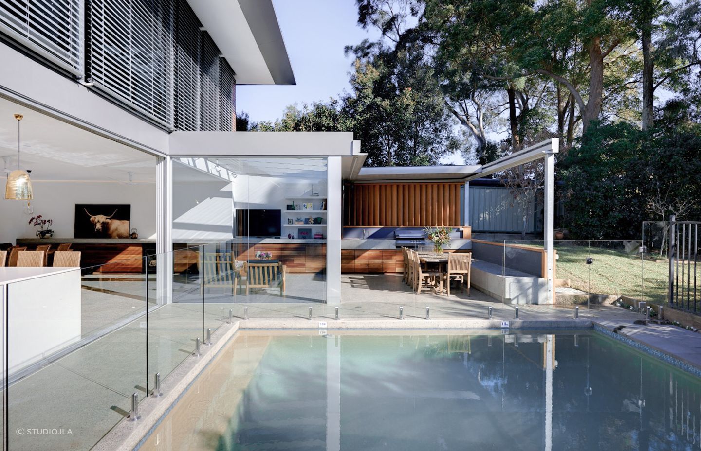 Pool landscaping doesn't always need to focus on plants and greenery, the right out door furniture and materials can lead the design. Featured project: Gladesville House - StudioJLA