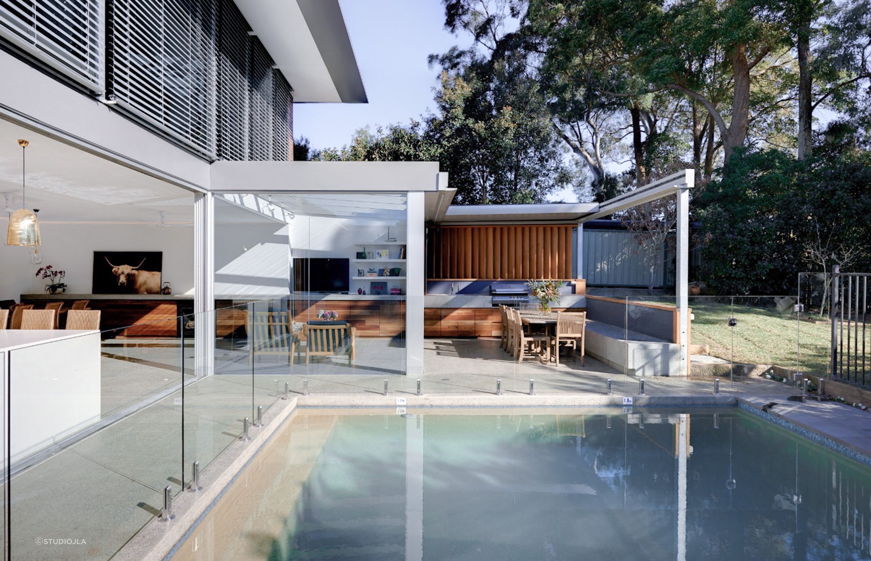 Pool landscaping doesn't always need to focus on plants and greenery, the right out door furniture and materials can lead the design. Featured project: Gladesville House - StudioJLA