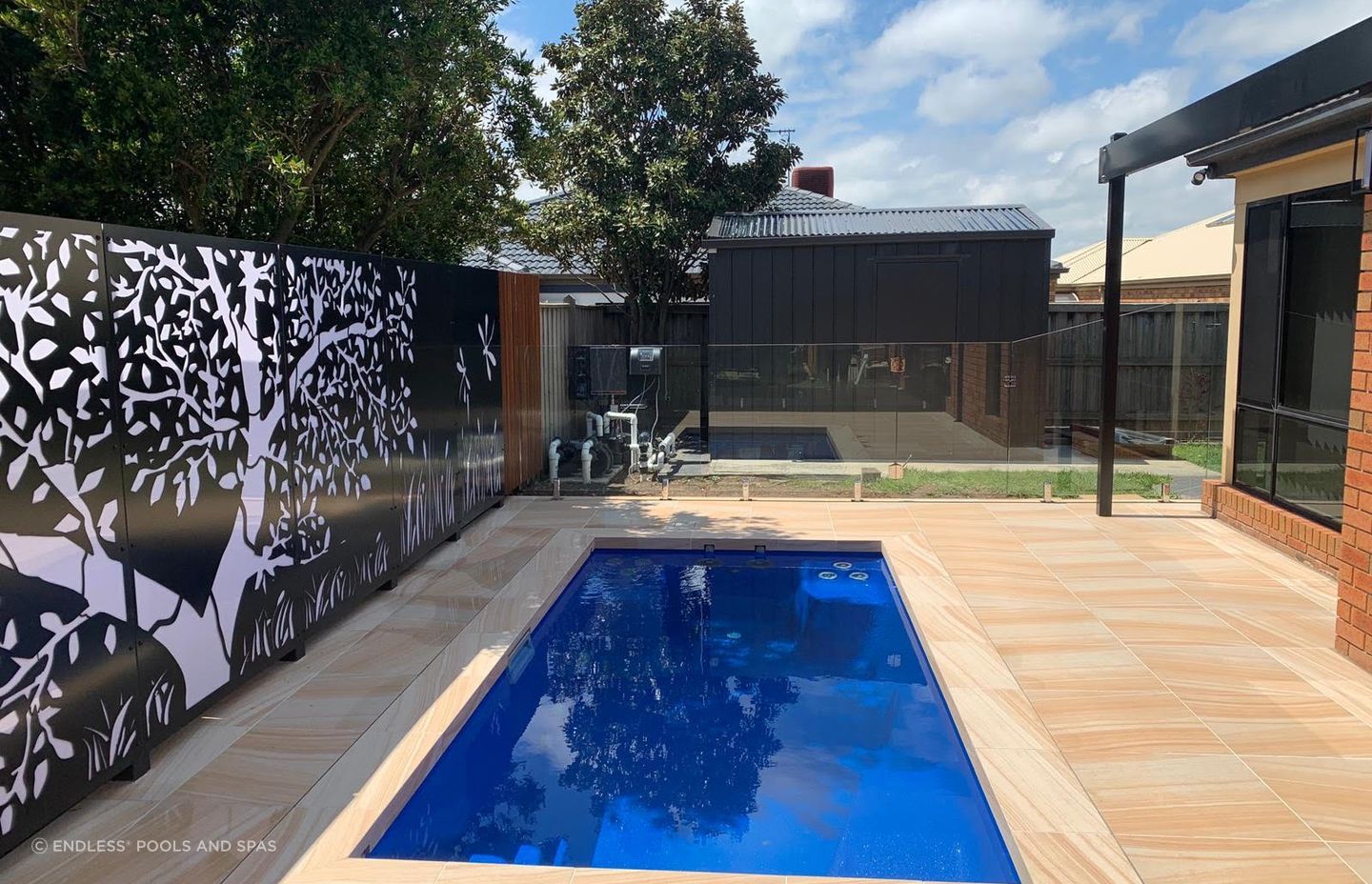 In-ground plunge pool can often be integrated into an existing outdoor feature such as deck or patio. Featured Product: Jaguar by Endless Pools and Spas.