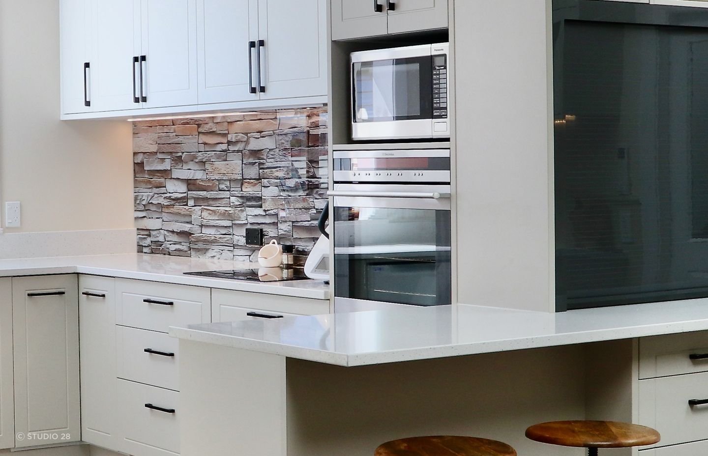 A thoroughly convincing take on the brick splashback in this clever kitchen renovation.