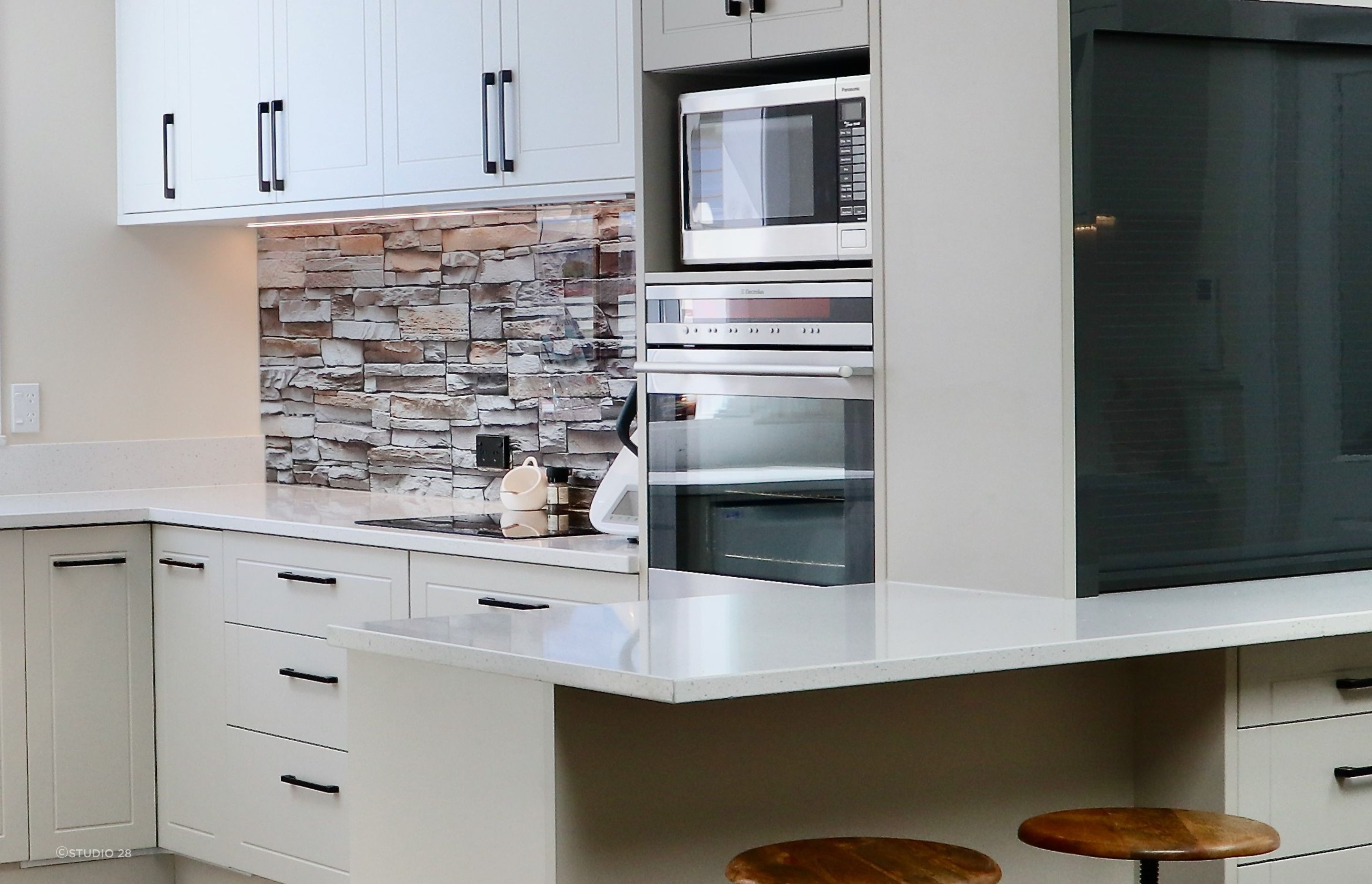 A thoroughly convincing take on the brick splashback in this clever kitchen renovation.