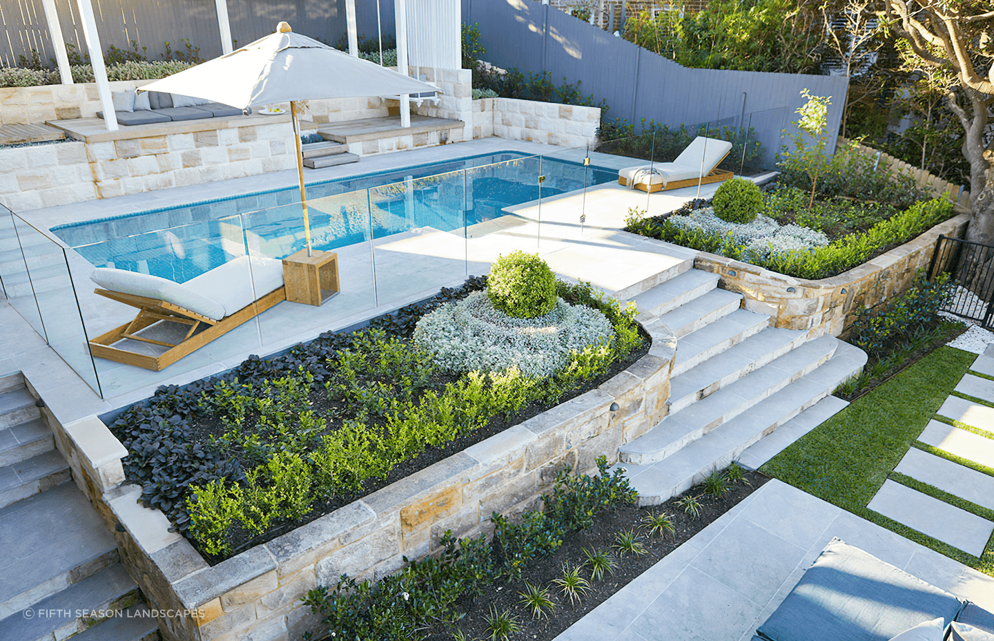 These flower beds are well positioned to draw the eye to the pool, while capturing natural light. Featured project: Longueville Project 1 - Fifth Season Landscapes