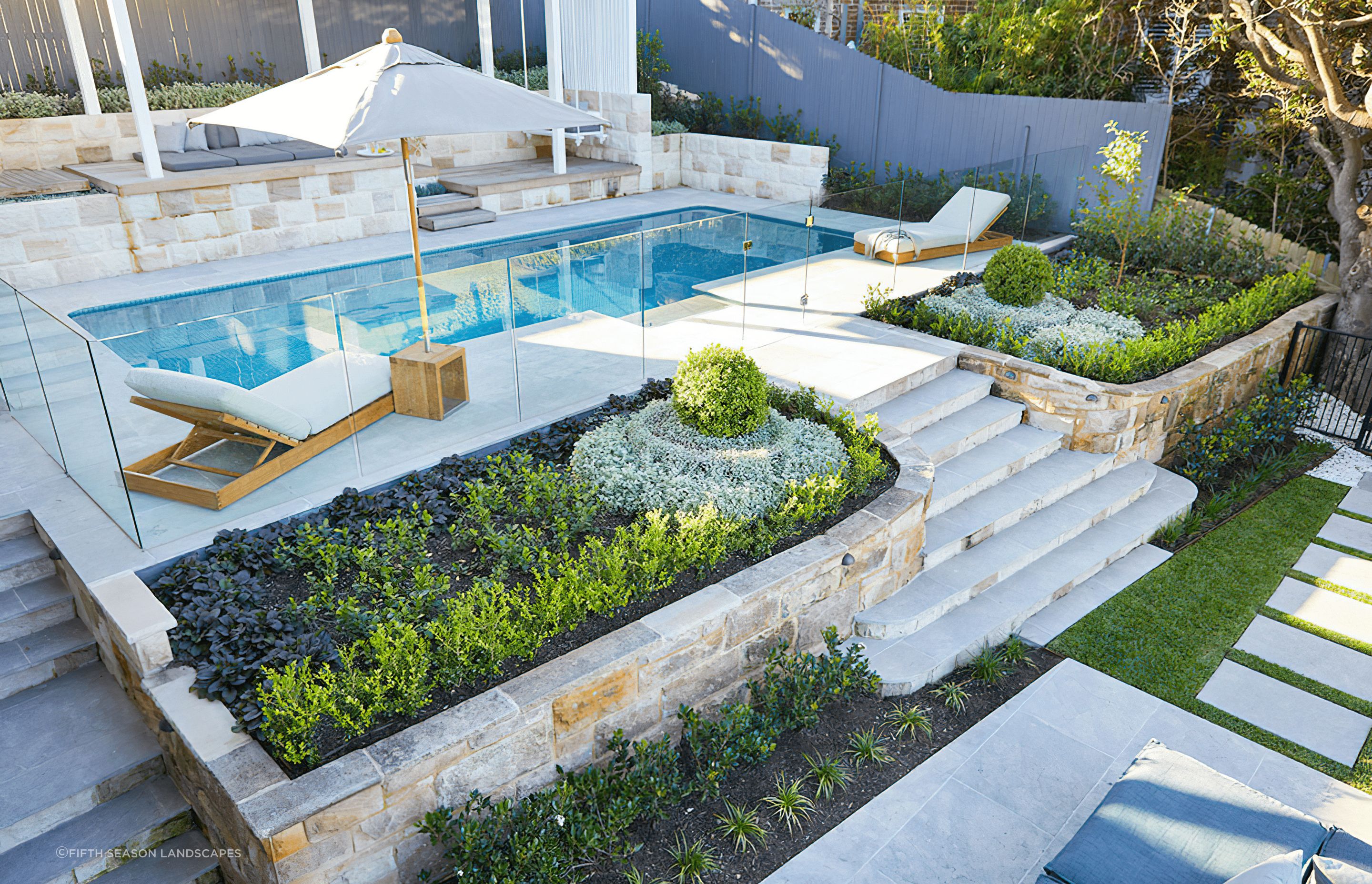 These flower beds are well positioned to draw the eye to the pool, while capturing natural light. Featured project: Longueville Project 1 - Fifth Season Landscapes