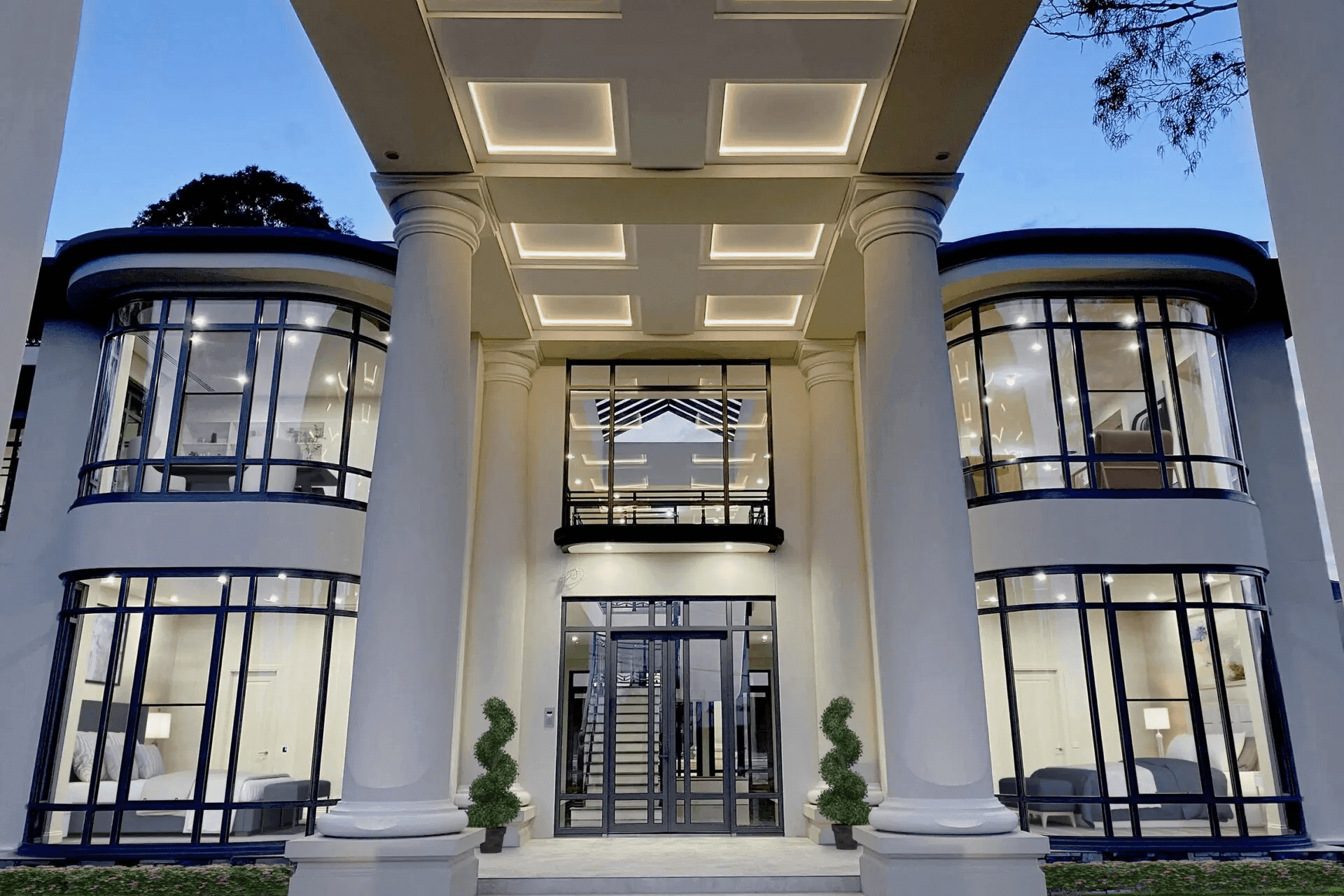 These glass front entrance doors, accompanying the various windows, let in plenty of natural light. Featured project: Lum Road Residence by Caulfield Krivanek Architecture
