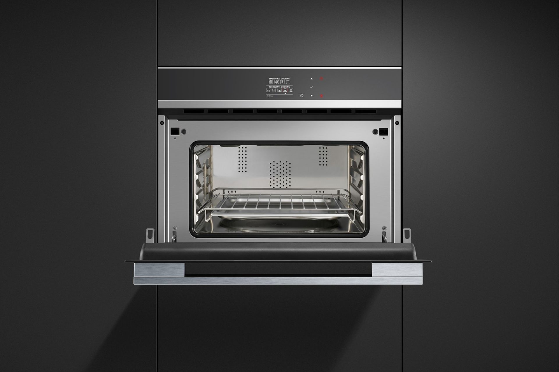 Smaller than a conventional oven meaning there is less to clean — the Stainless Steel Combination Microwave Oven from Fisher & Paykel.