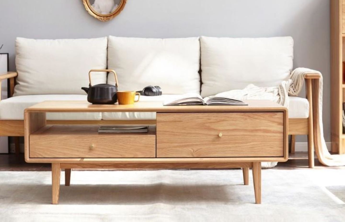 A trendy teapot adds warmth to this living space, featuring the homely Oslo Natural Solid Oak Coffee Table.