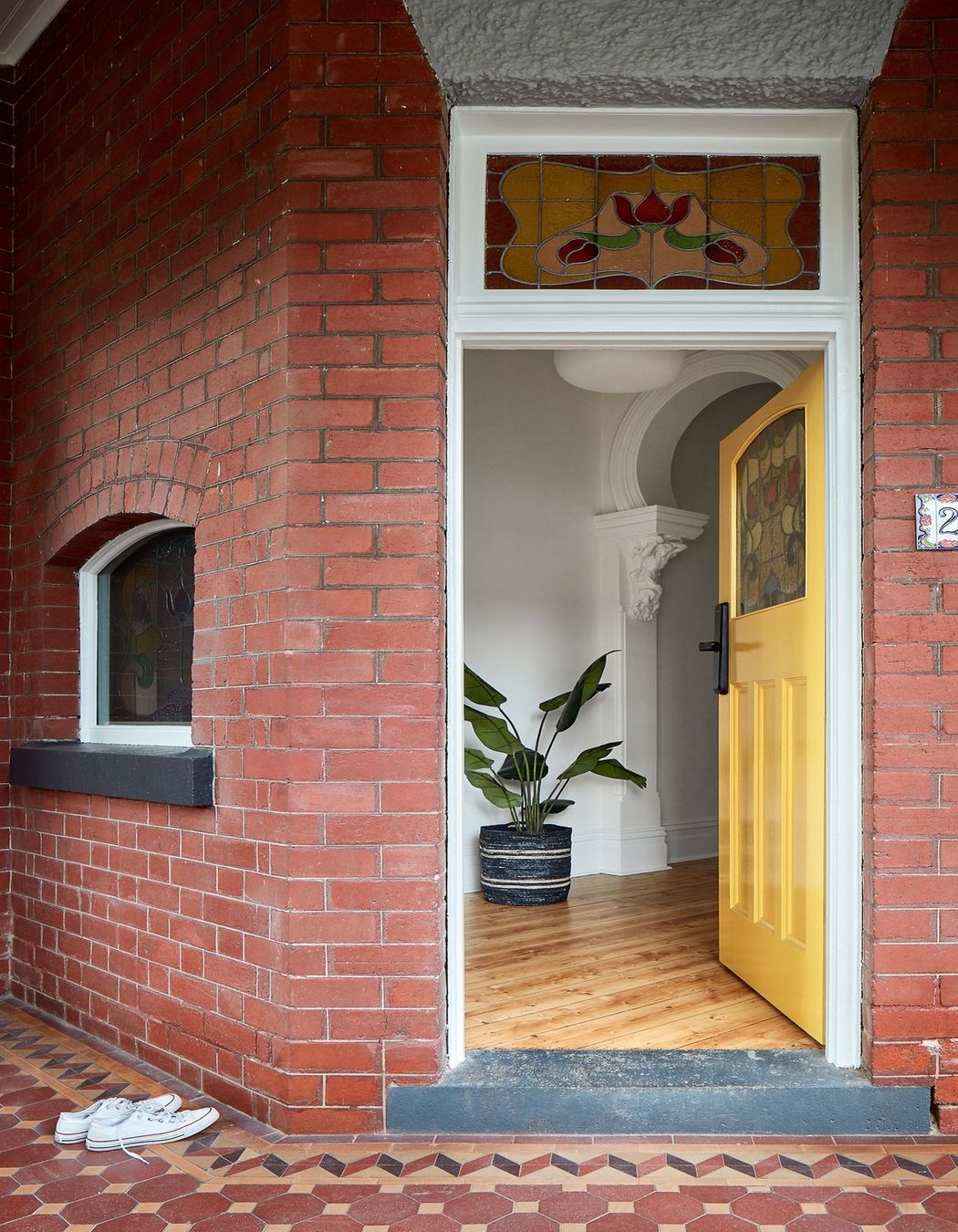 A yellow front door gives a home a bright, welcoming feeling. Featured project: Pine by Bryan Alsop Architects