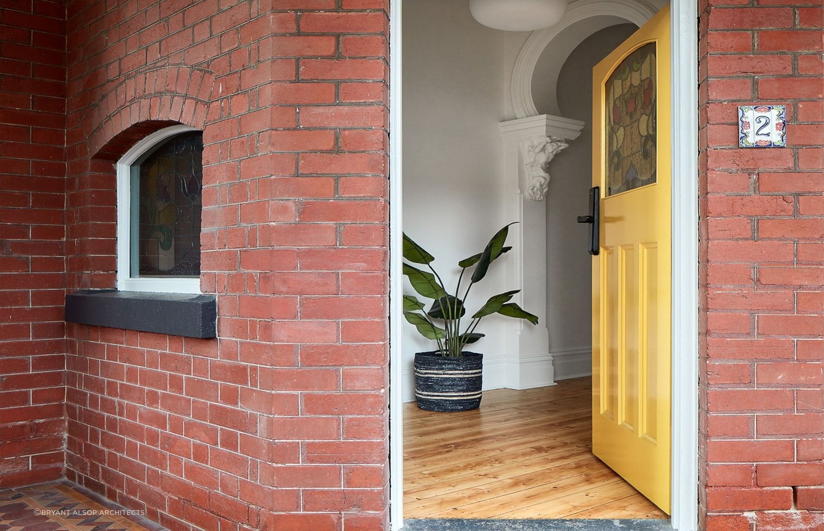 A yellow front door gives a home a bright, welcoming feeling. Featured project: Pine by Bryan Alsop Architects