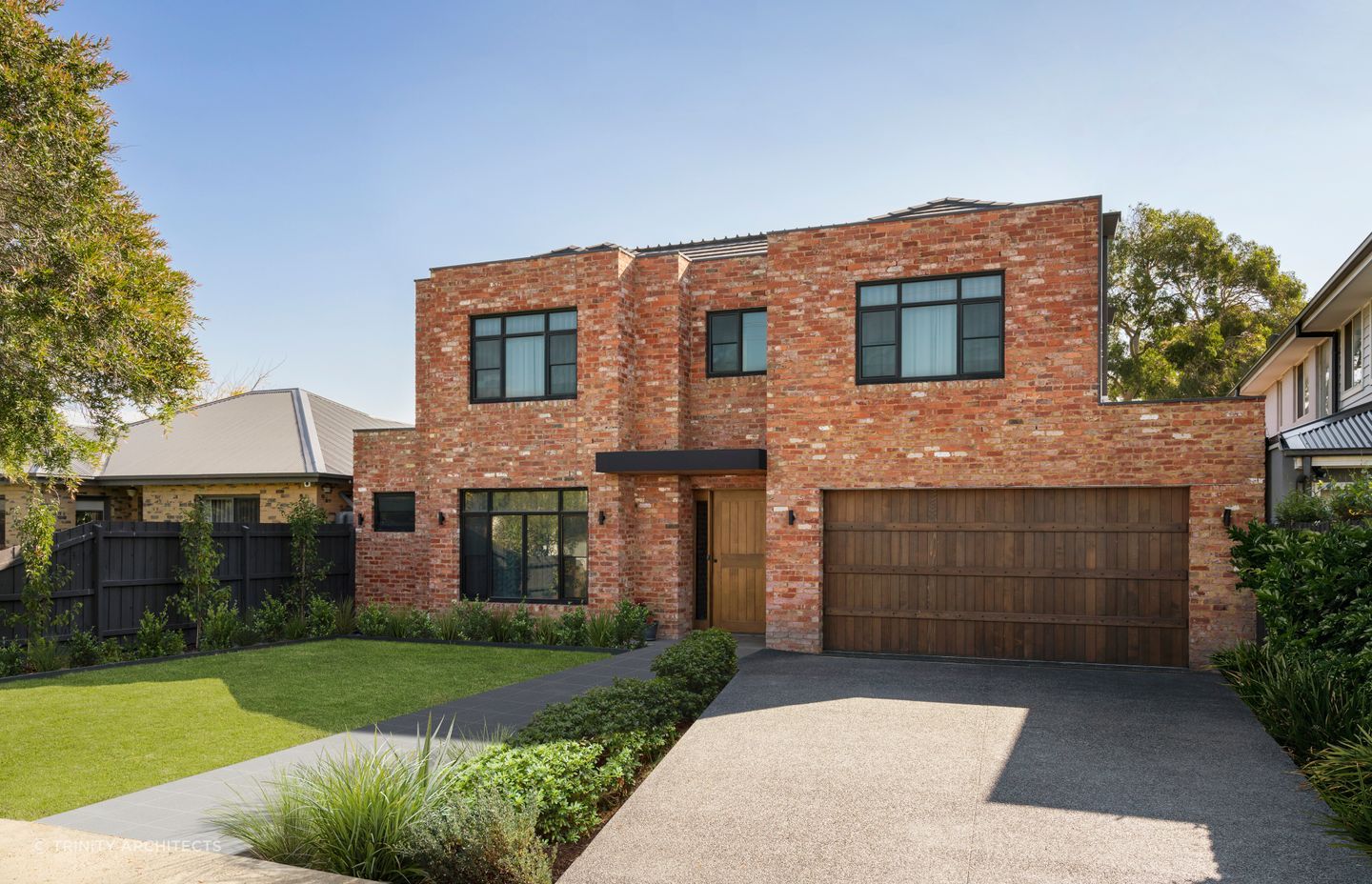 The tonality differences between the front door and the brickwork creates a striking statement. Featured project: Project One by Trinity Architects