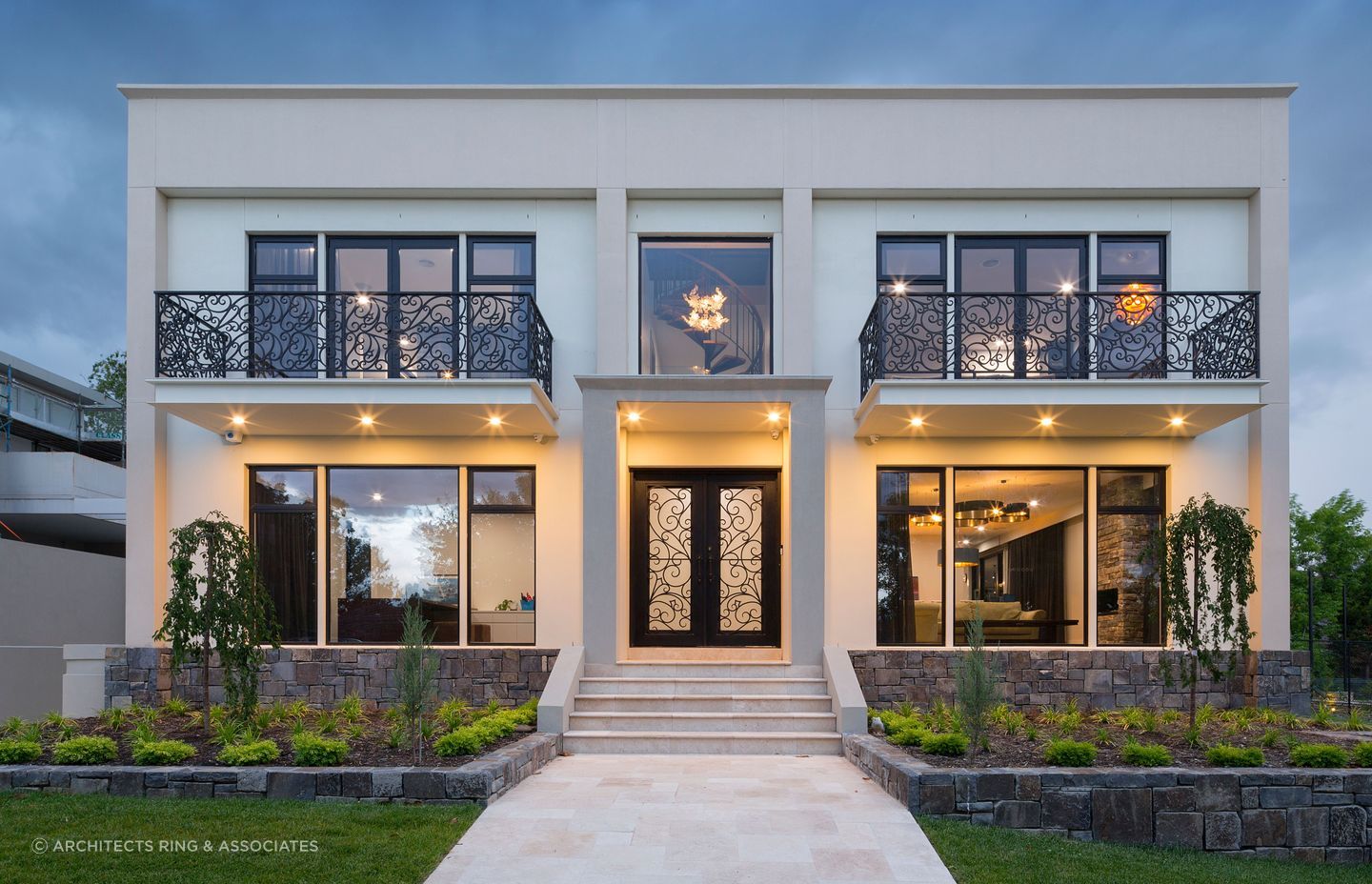 The entrance of this residence strikes a balance between tradition and modernity, with an elegant wrought-iron front door that offers both security and artistry. Featured project: Richardson by Architects Ring &amp; Associates