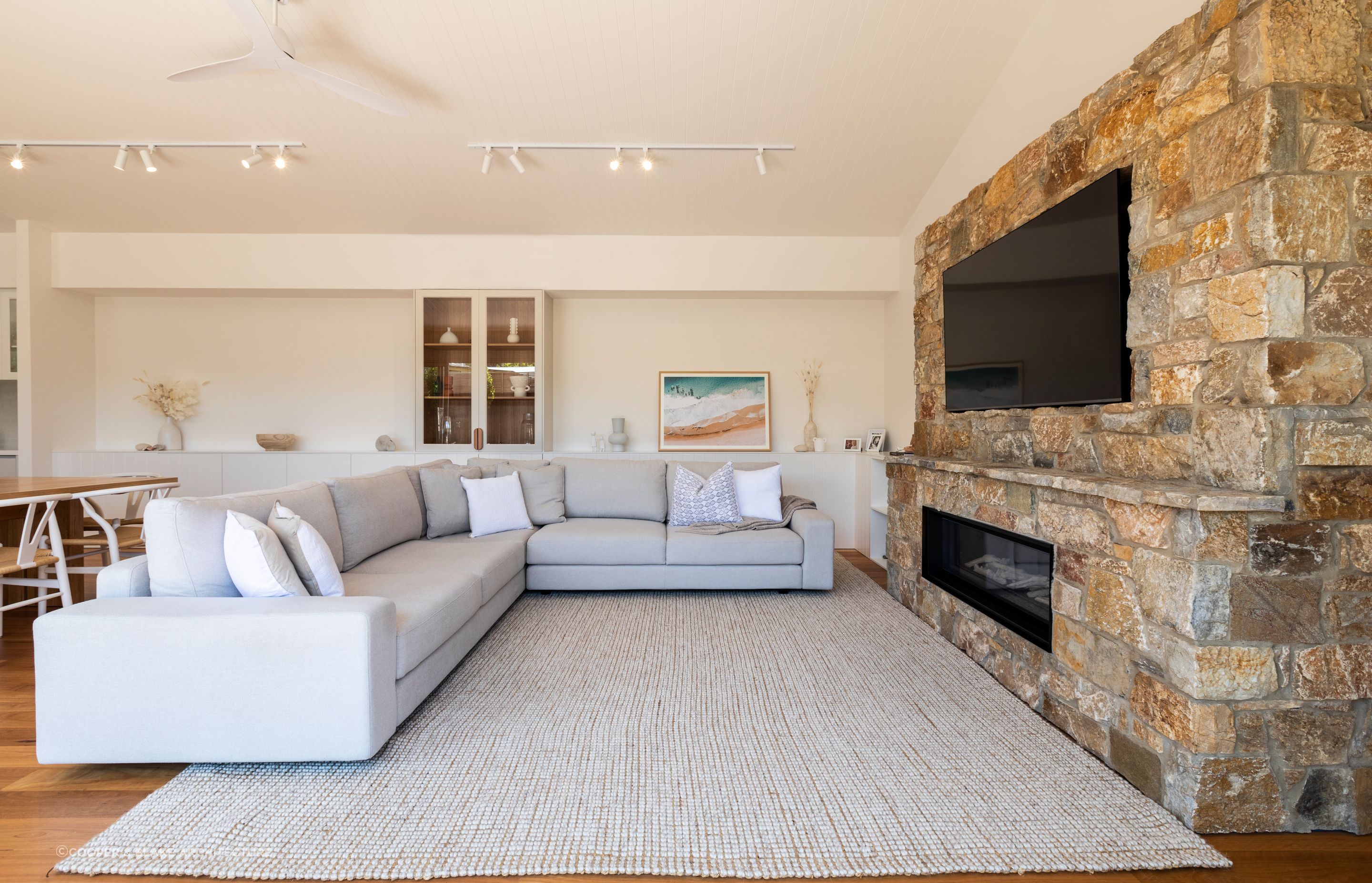 A brick or stone fireplace can be the centrepiece in a Hamptons-style living room. Project: Munday in the Hamptons by Copper &amp; Blake Architecture.