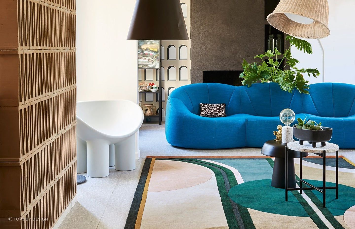 The Sonia Rug by top3 by design features a stunning multi-color palette that effortlessly brings the room together