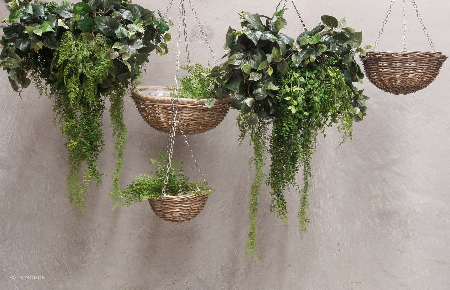 Hanging baskets are a pretty, biophilic addition to a home office. Pictured are rattan baskets by Le Monde.