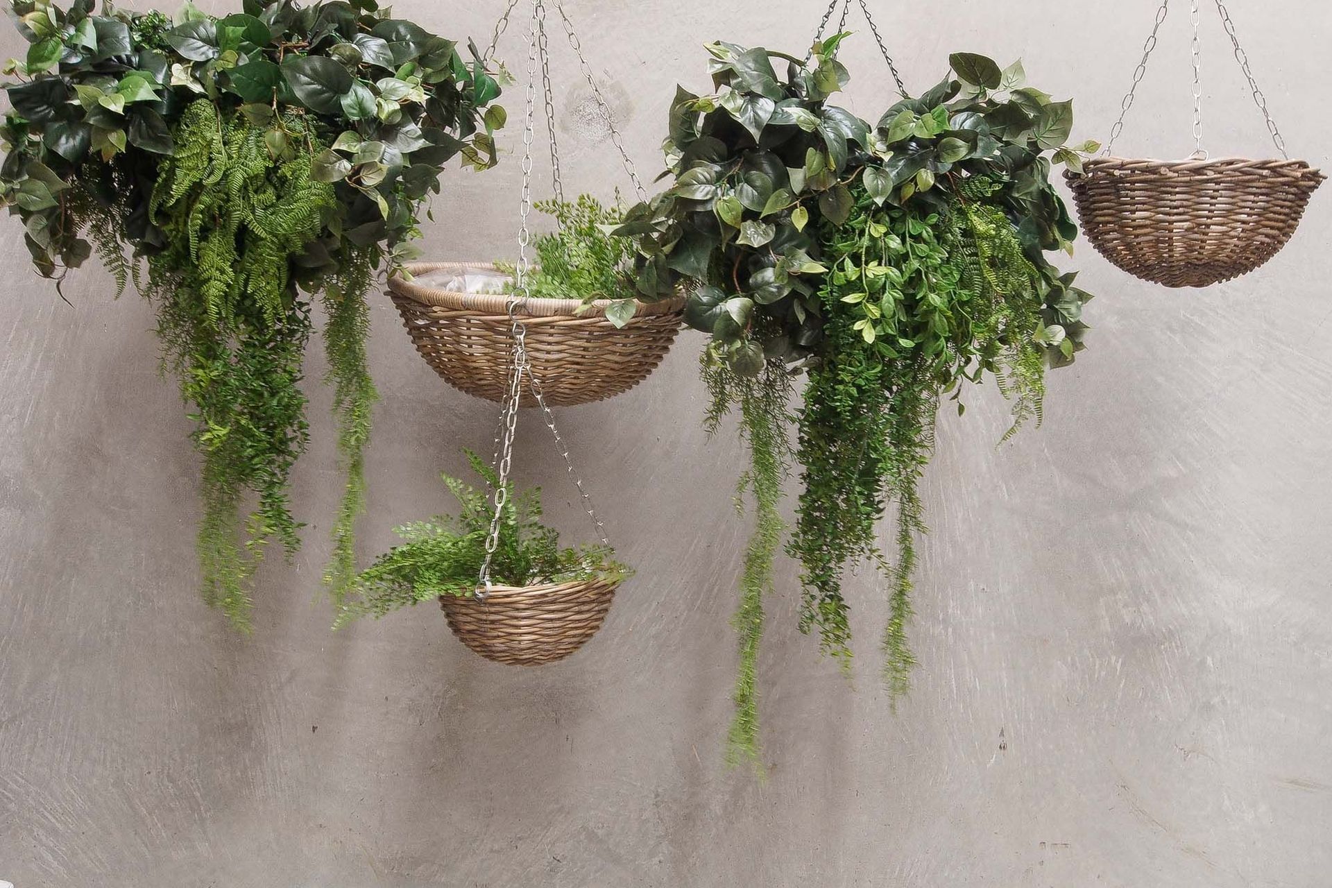 Hanging baskets are a pretty, biophilic addition to a home office. Pictured are rattan baskets by Le Monde.