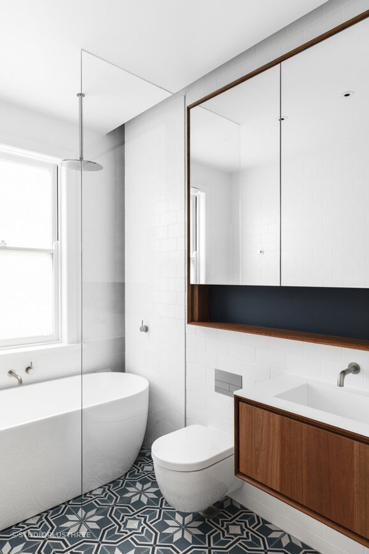 Floating toilet and vanity creating space at Cooks River House