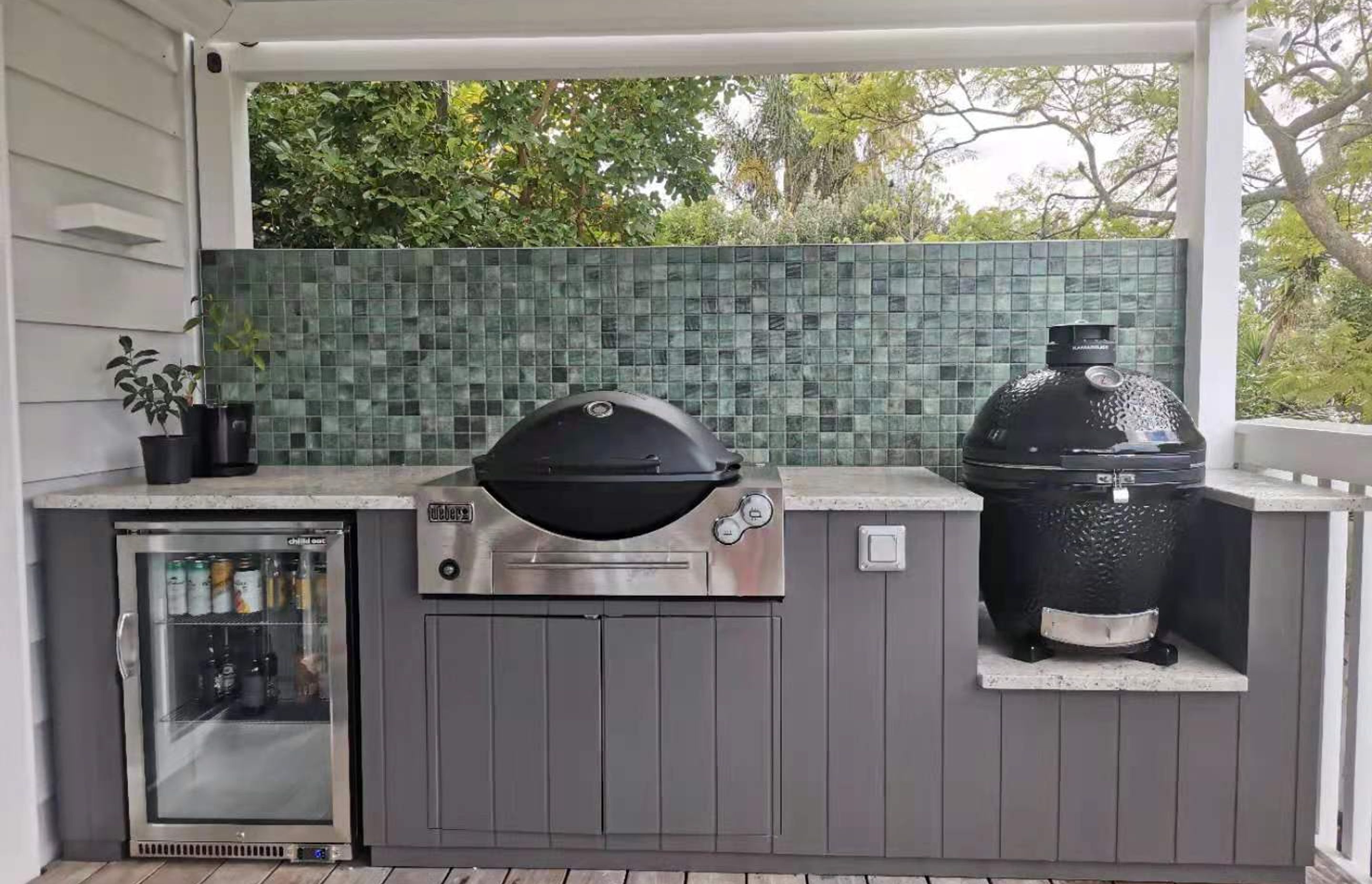 Incorporate a refrigerator, bbq and smoker into your outdoor kitchen for a full culinary experience.