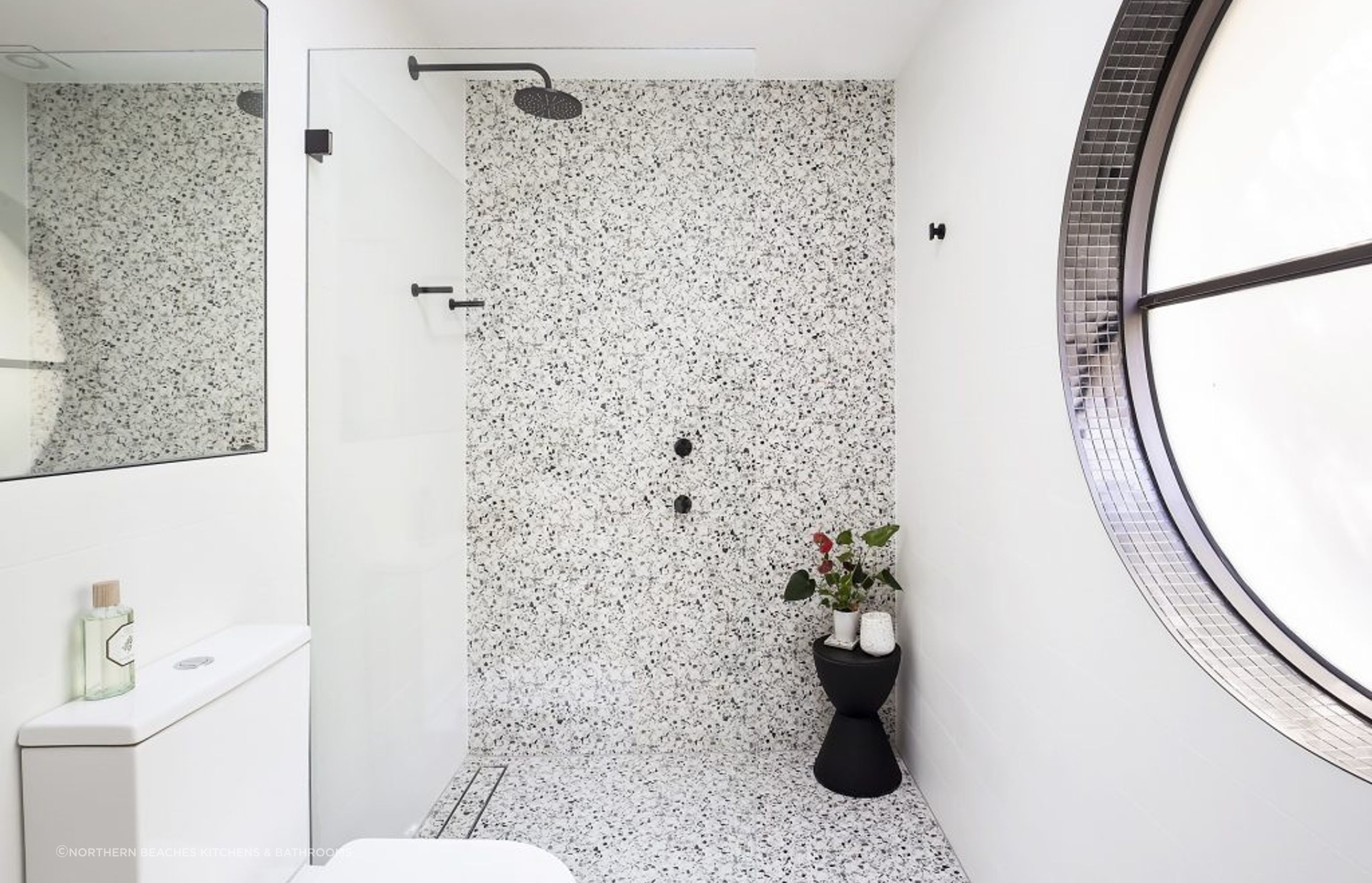 A stylish black and white theme features at Clareville Bathroom
