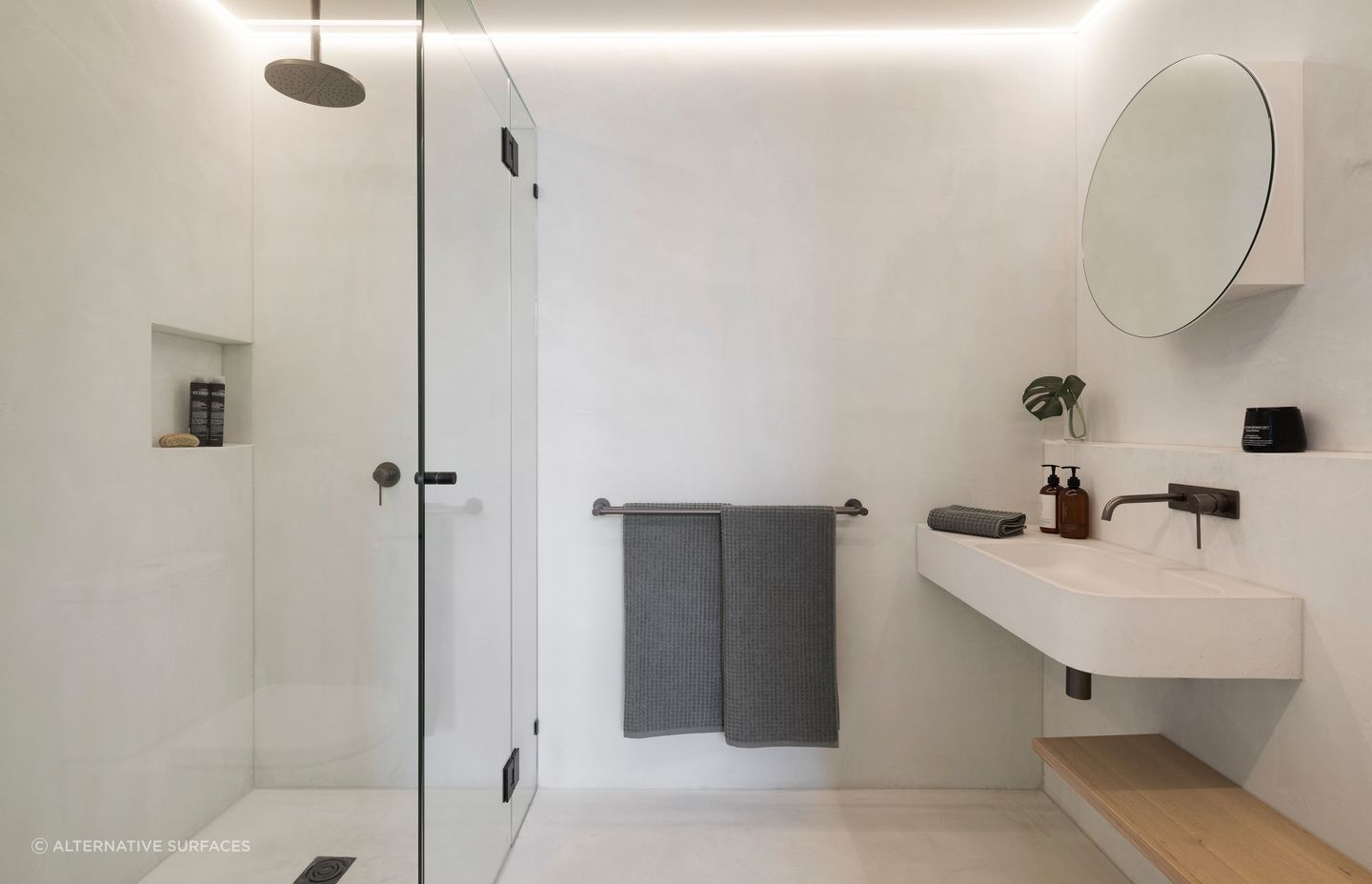 Strip lighting illuminates a minimalist bathroom at King St Townhouse | Photography: Dylan James Photo