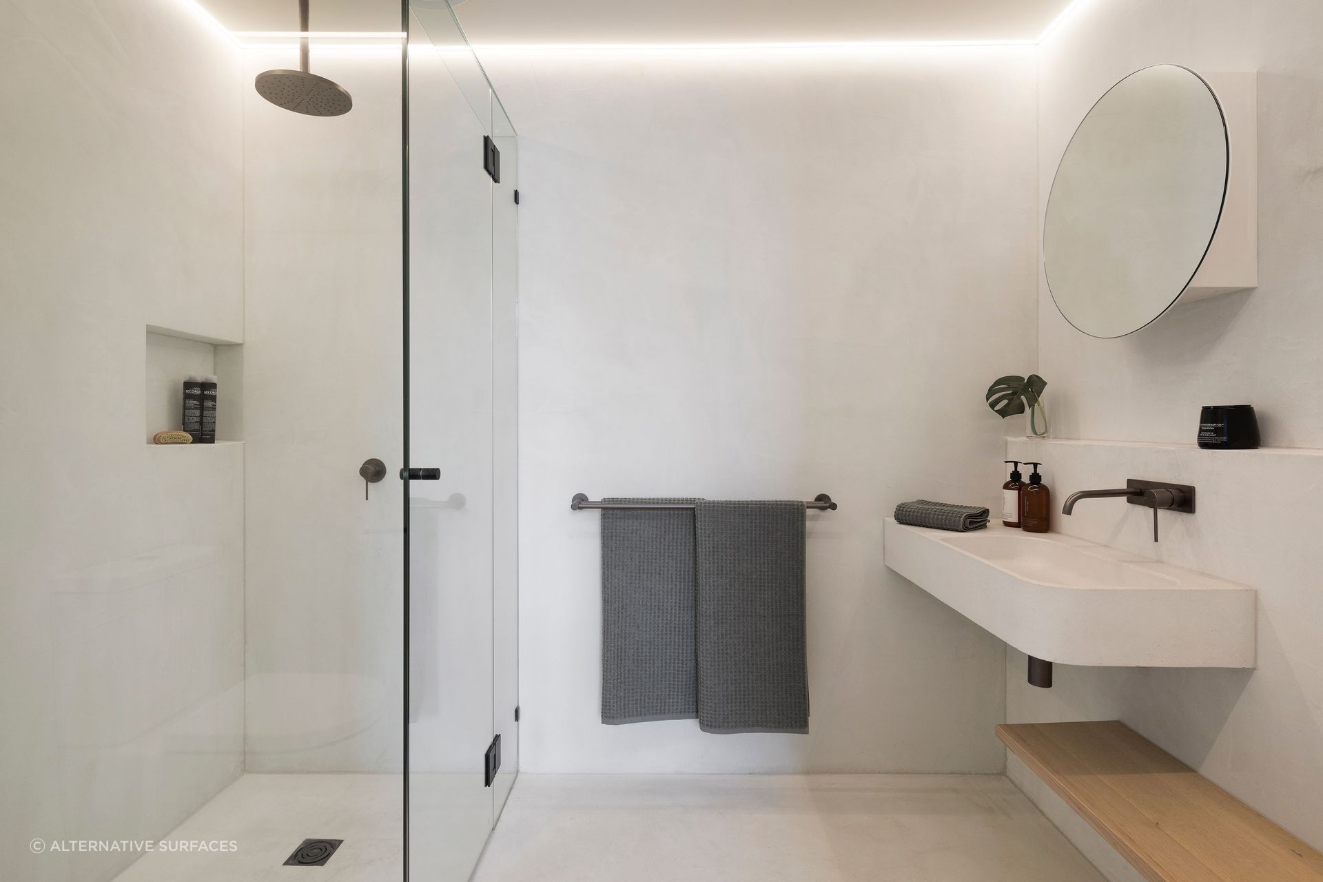 Strip lighting illuminates a minimalist bathroom at King St Townhouse | Photography: Dylan James Photo