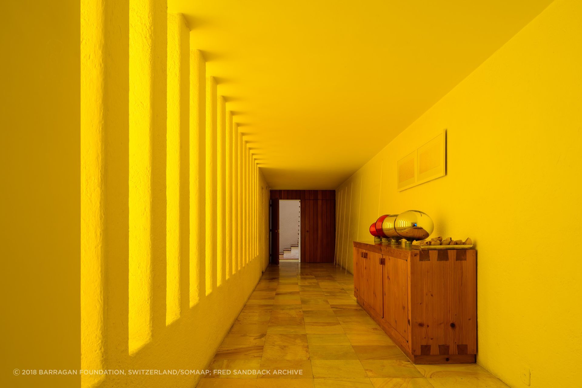 Coloured concrete can be complimented by a clever use of light. At Luis Barragán's Casa Gilardi, only one wall in the pool corridor is yellow, the other is white. Light enters through the adjacent courtyard, creating a warm glow.