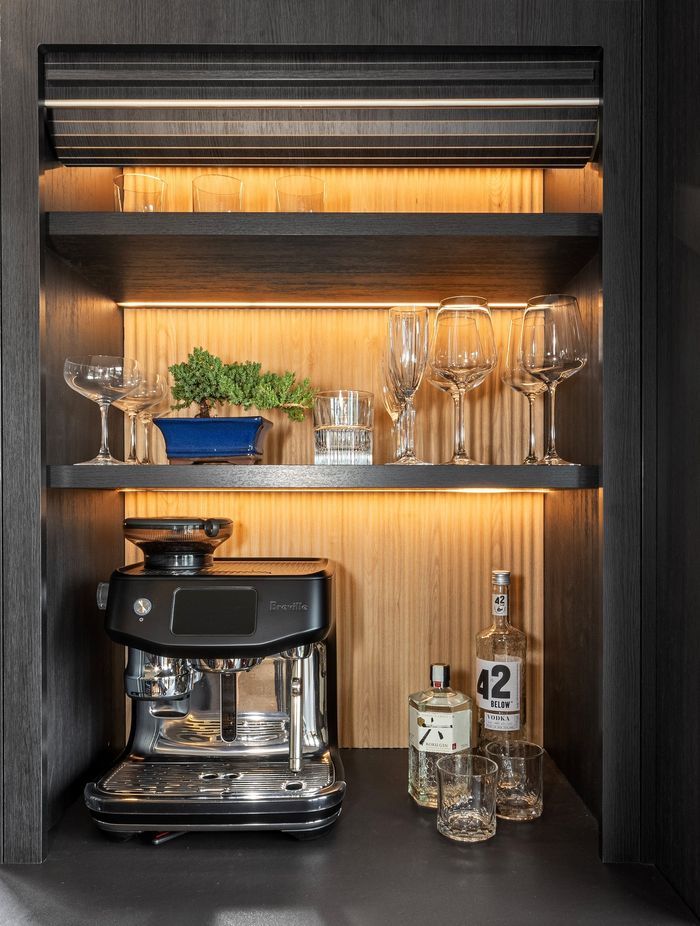 “The clients are steel fabricators, so aesthetically they wanted old-meets-new, dark, pops of oak, and a nod to steel that complemented the Rimu joinery.”