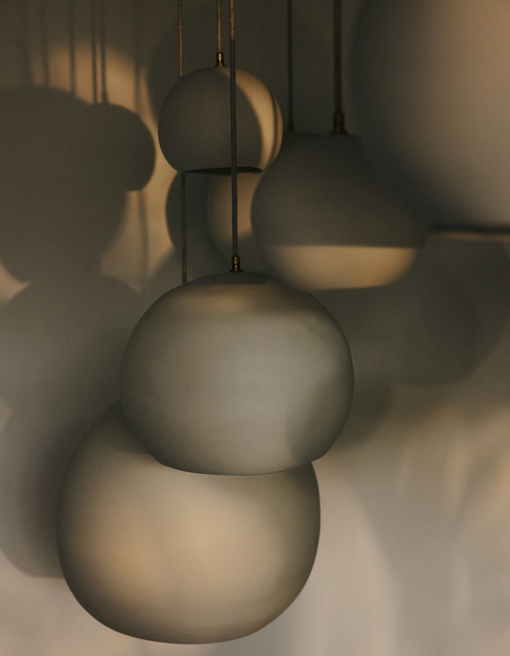 Hand-carved, the pendants are made from Australian porcelain.