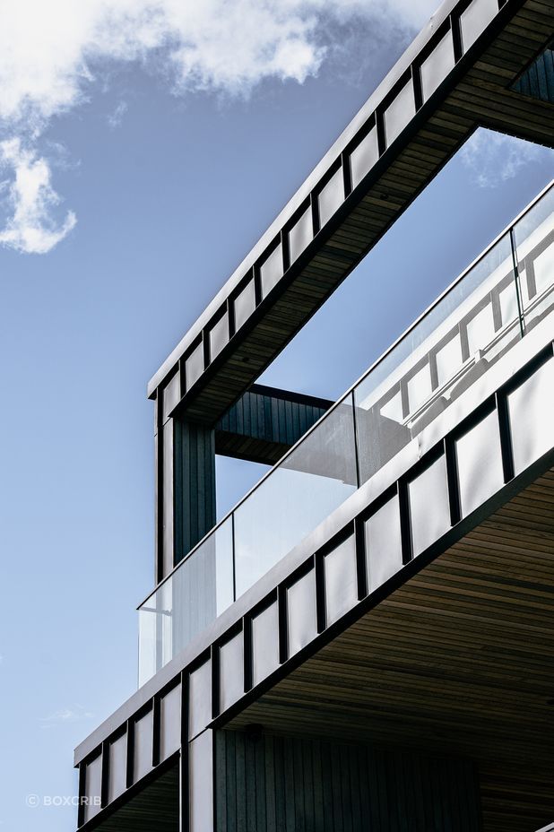 The home makes good use of balconies that direct residents toward the stunning views.