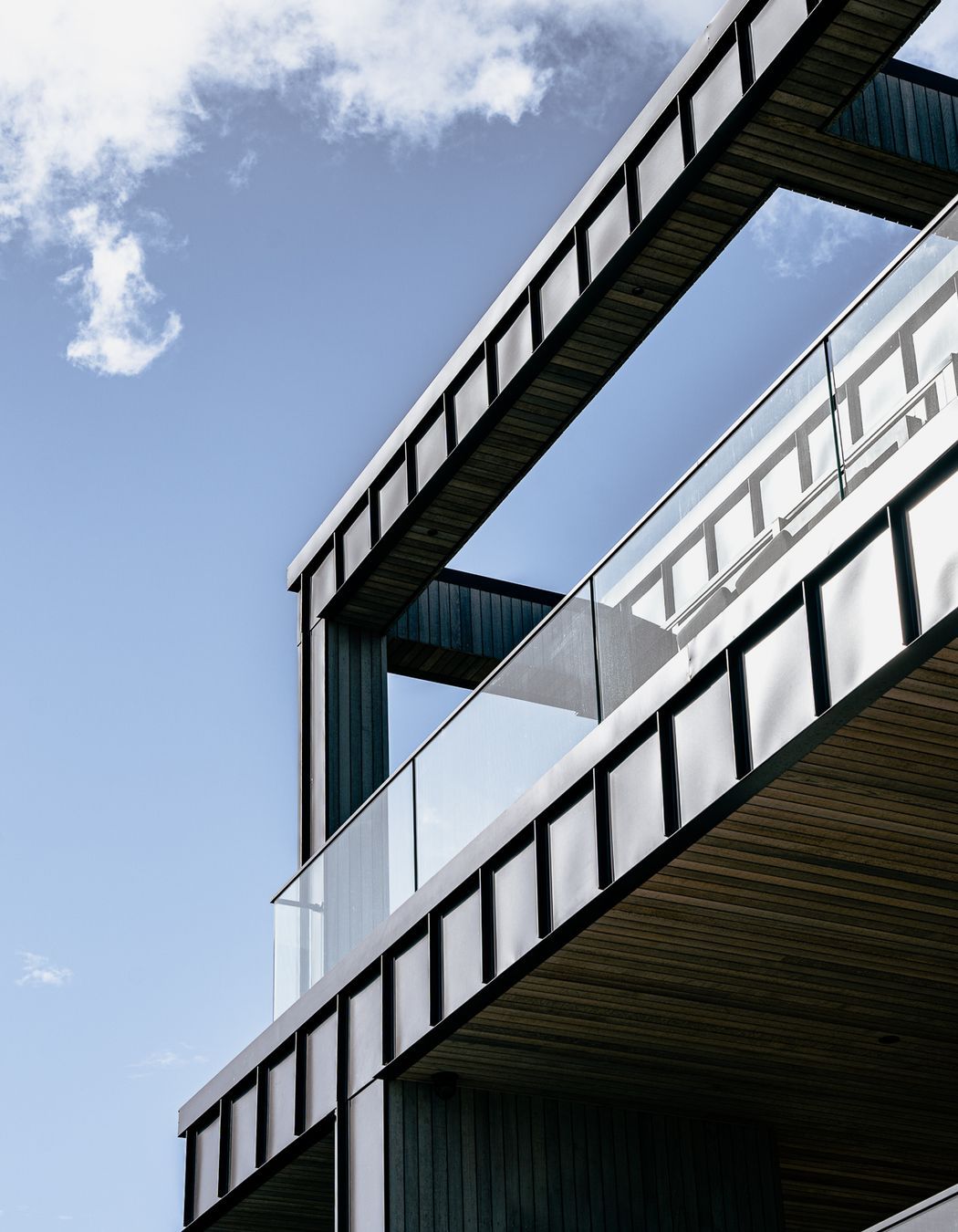 The home makes good use of balconies that direct residents toward the stunning views.