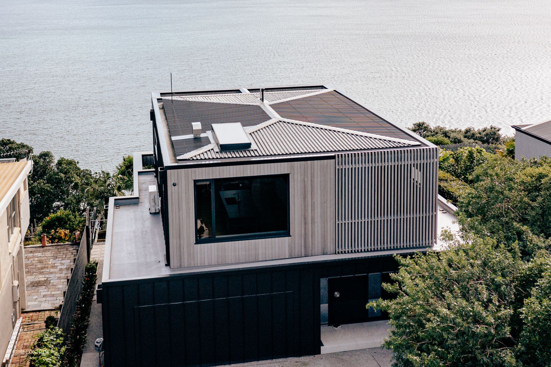 The site has commanding views of the bays on the Whangaparāoa Peninsula.