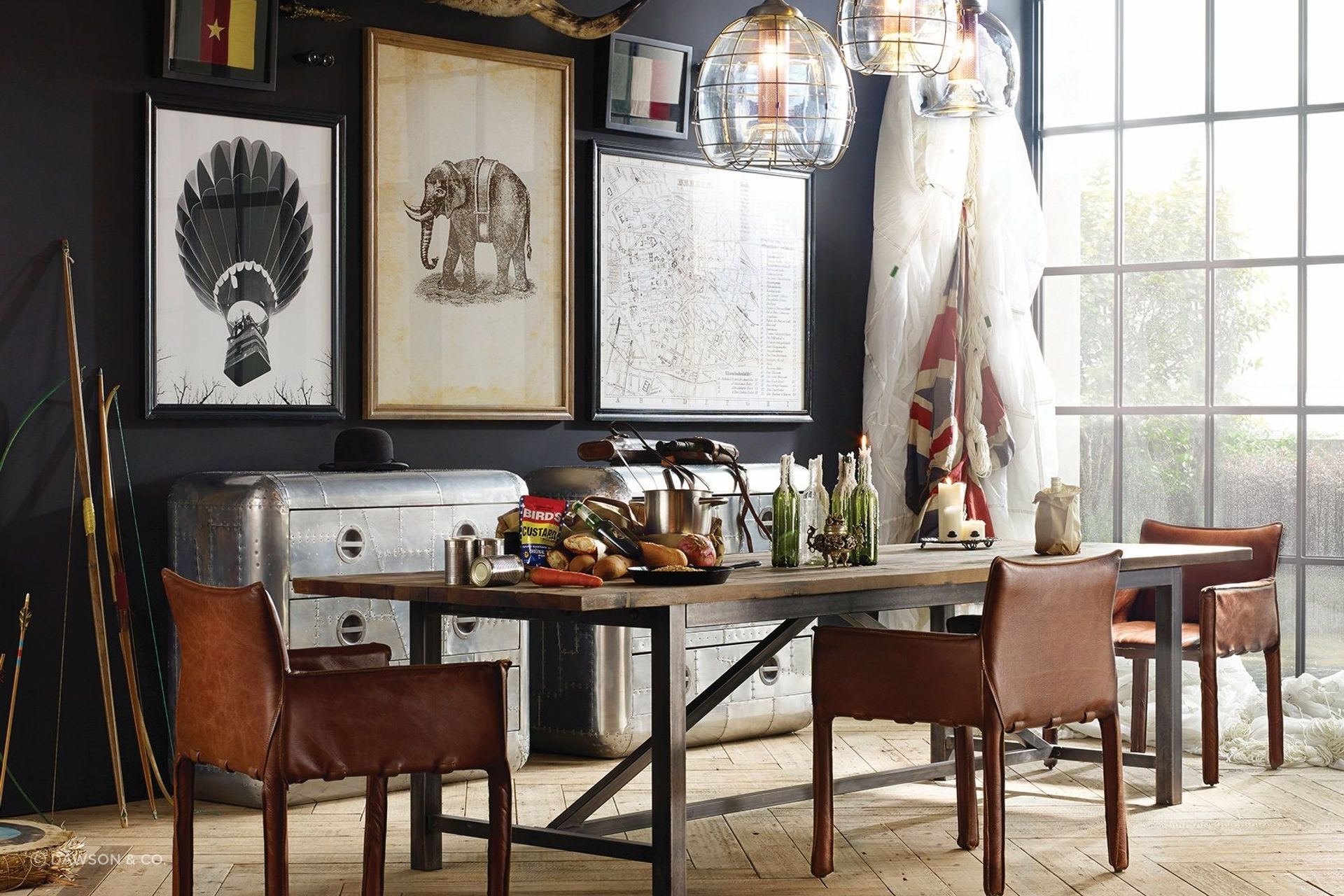 The bold and unique Axel Parquet Dining Table by Timothy Oulton complemented by an eclectic collection of wall art for a dining room full of character.