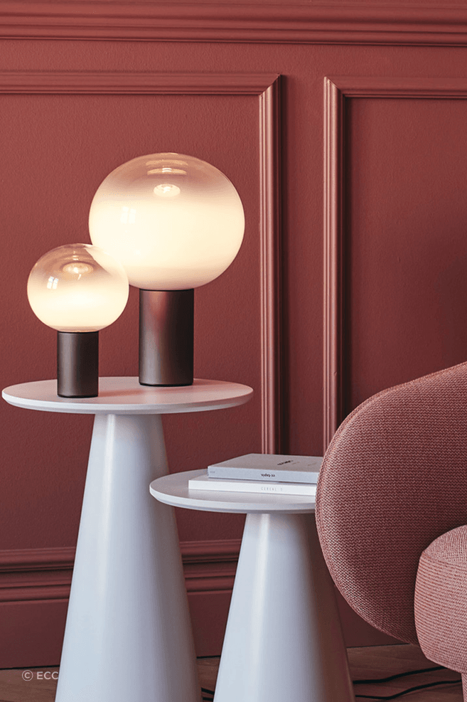 The stunning spherical lamp of the Laguna Table Lamp by Artemide is a real eye-catching feature.