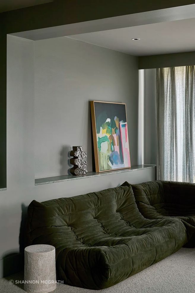 In the more modern pre-existing extension at Kooyong Classic, Clemenger drenches the room in a single colour to give all the different planes visual cohesion.