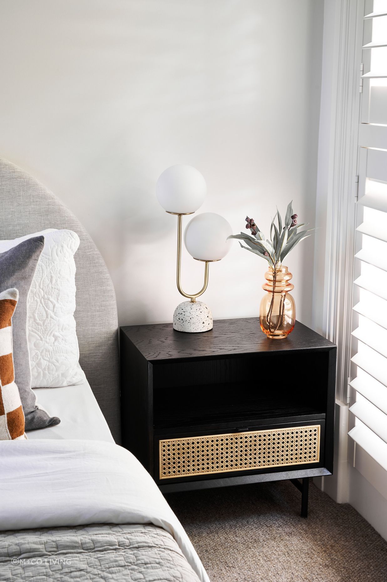 In addition to being used for stand-alone side tables, rattan is often incorporated as a design element in hardwood bedside tables, such as this Betty Side Table.