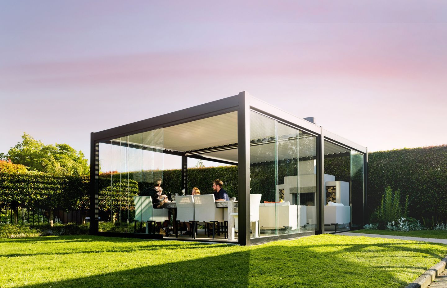 Sliding glass doors or dropdown awnings can be added to Juralco's outdoor living systems to increase their functionality and comfort year-round.