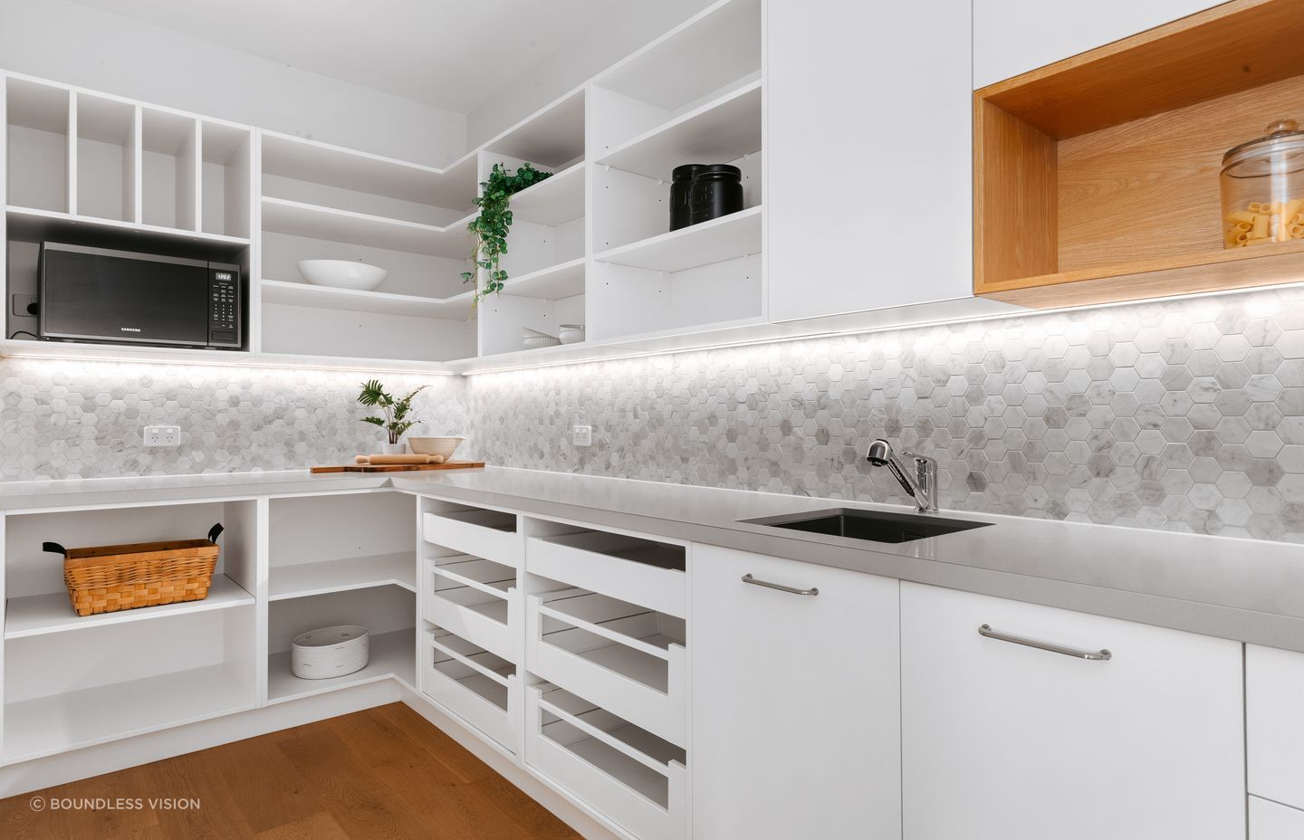 A large scullery is tucked behind the kitchen.