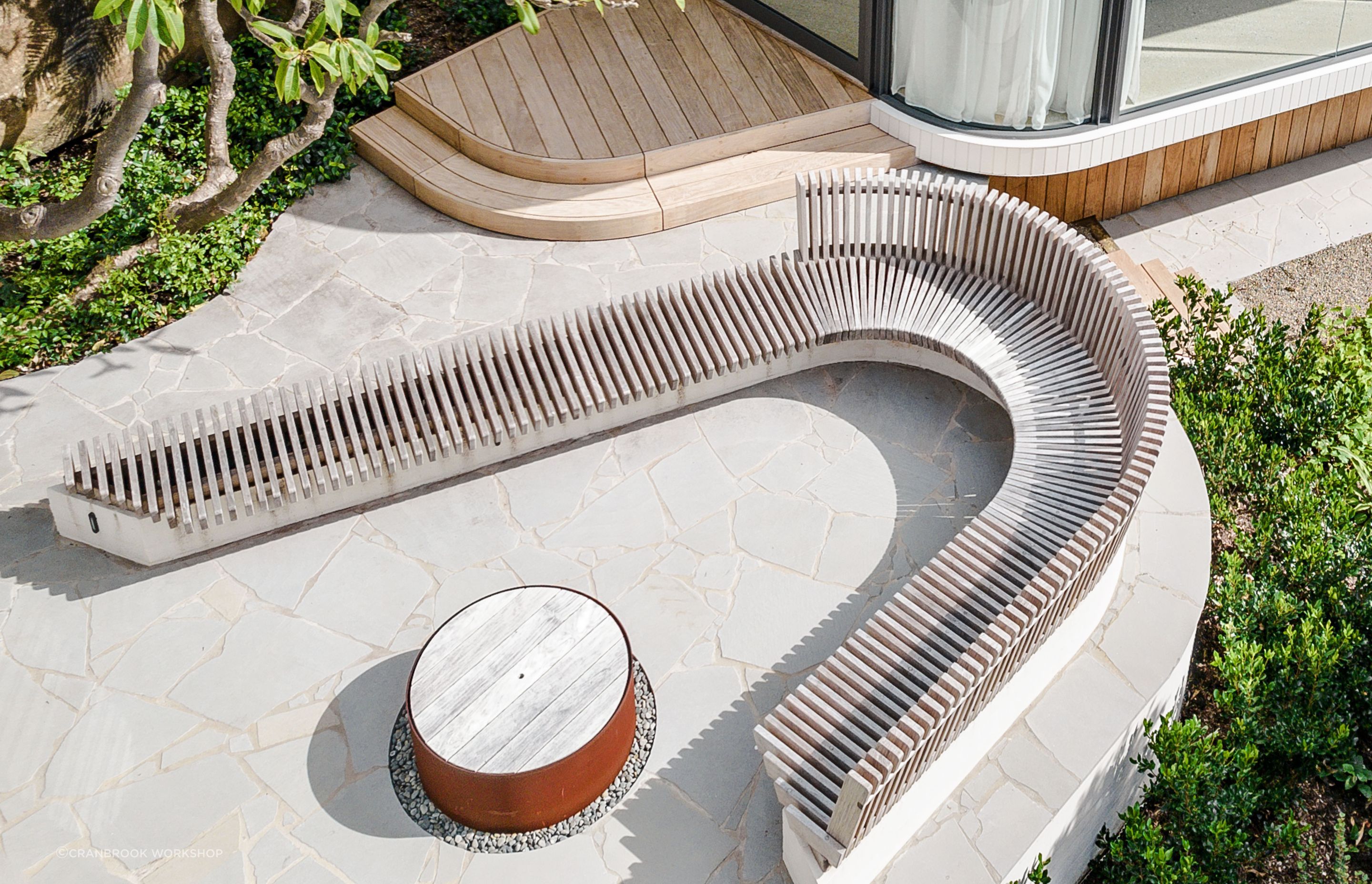 Curved outdoor seating for Clayton Orszaczky Architects.