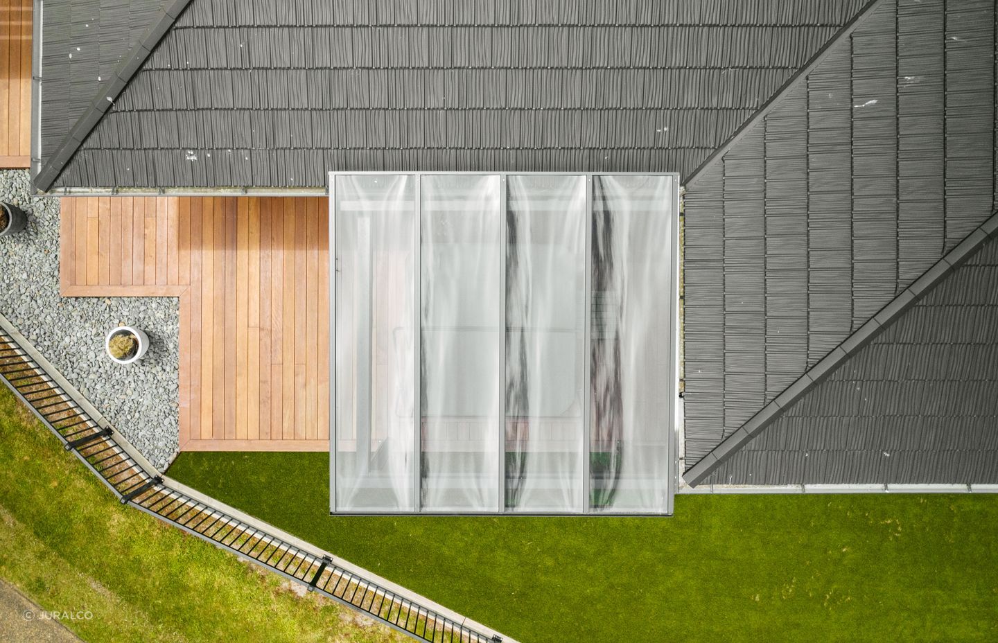 The VelaSun is a fixed outdoor pergola system with infill available as grey tinted polycarbonate or glass of your choice.